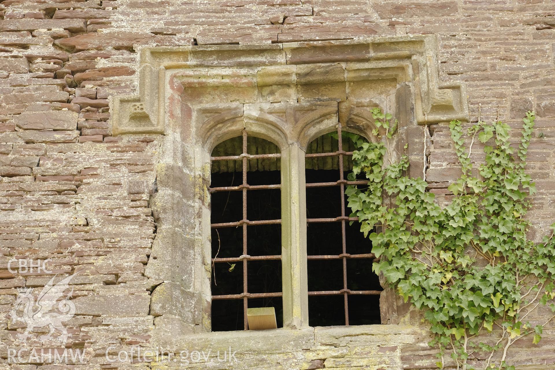 Colour photograph showing Great Porthmel Gatehouse - upper-stage window in NW front. Produced as part of Historic Building Recording for Great Porthamel Gatehouse, carried out by Richard Hayman, April 2021.