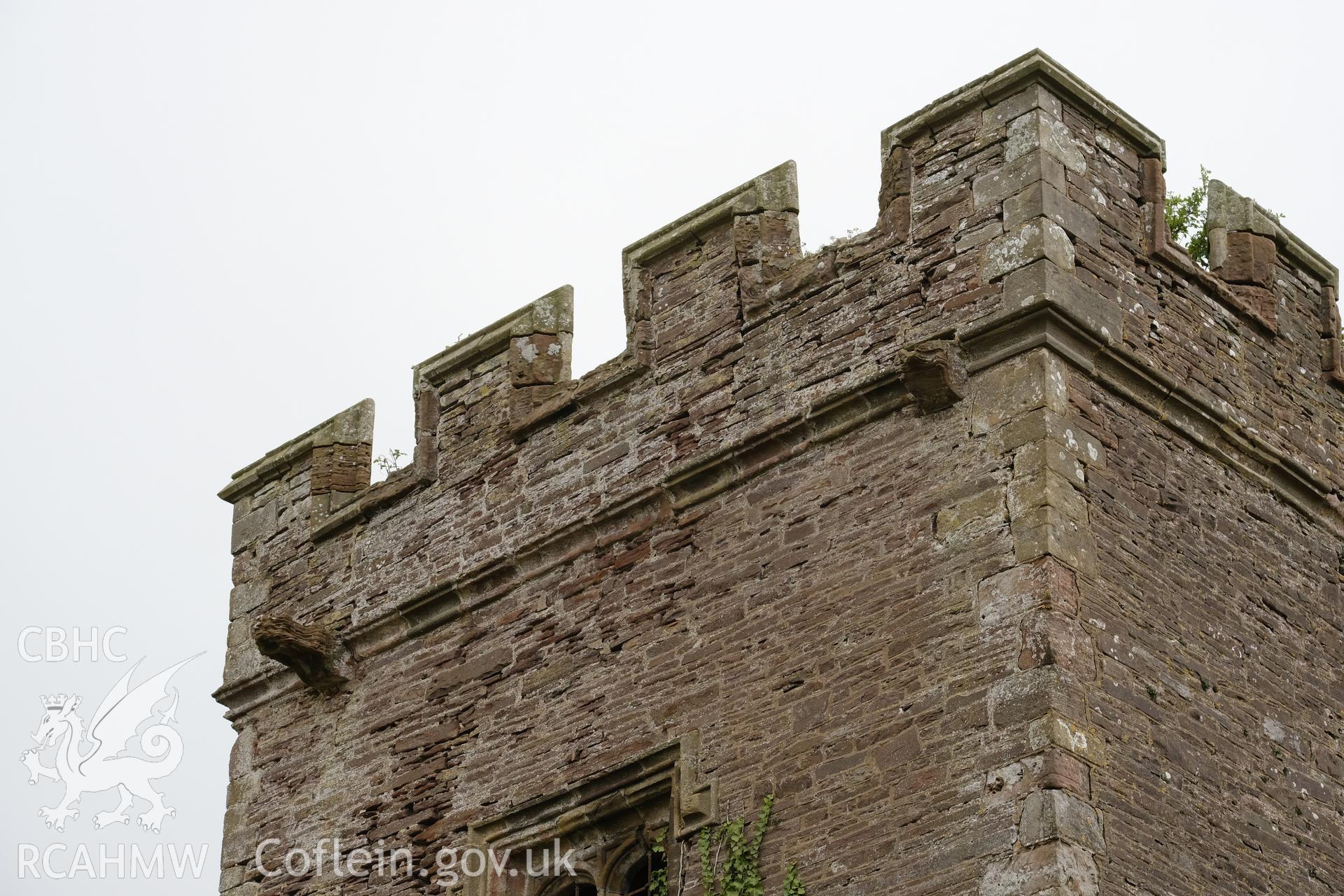 Colour photograph showing Great Porthmel Gatehouse - parapet NW front, looking NE. Produced as part of Historic Building Recording for Great Porthamel Gatehouse, carried out by Richard Hayman, April 2021.