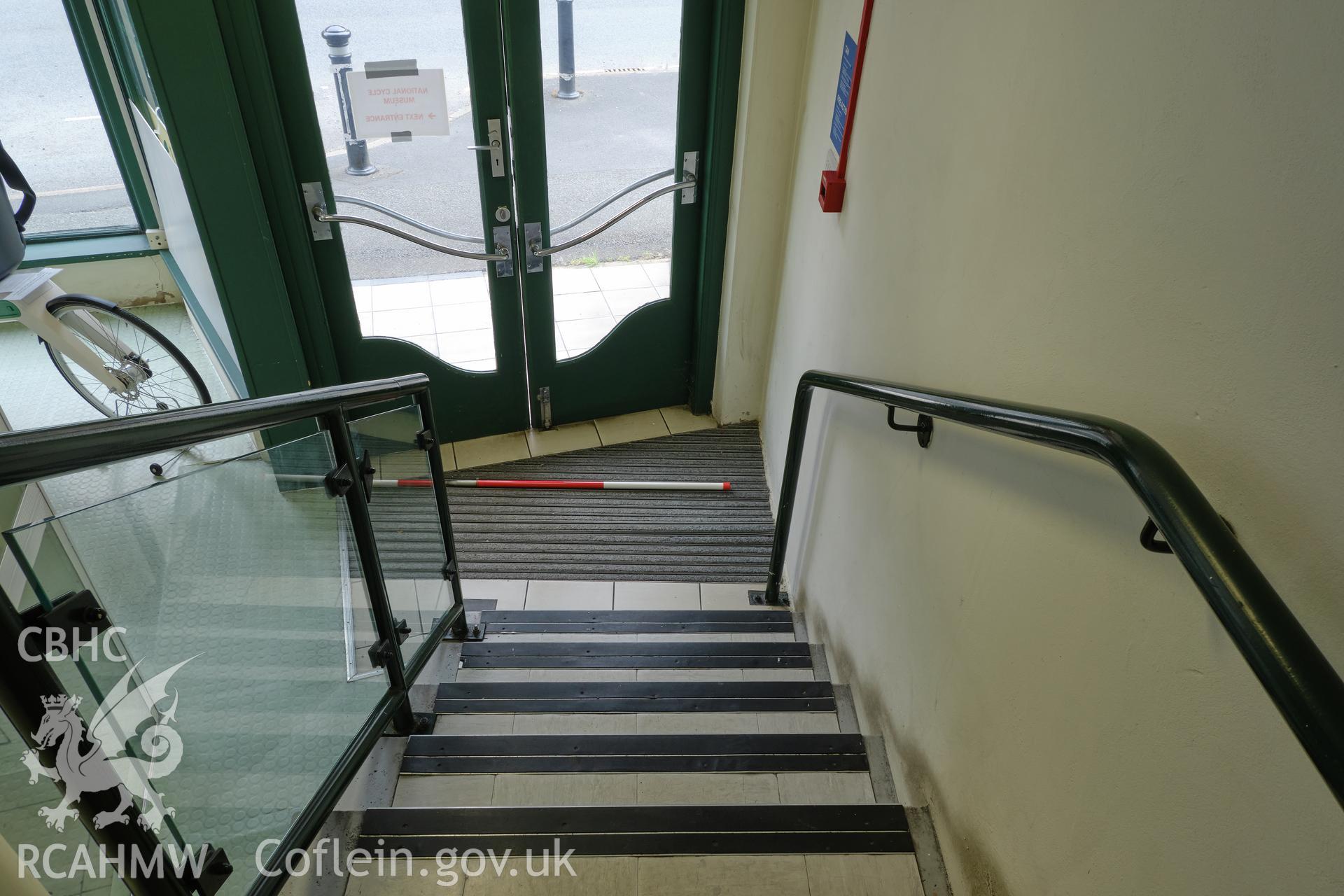 Colour photograph showing Automobile Palace - room G.12, looking N down stairs. Produced as part of Historic Building Recording for Automobile Palace, carried out by Richard Hayman, June 2021.