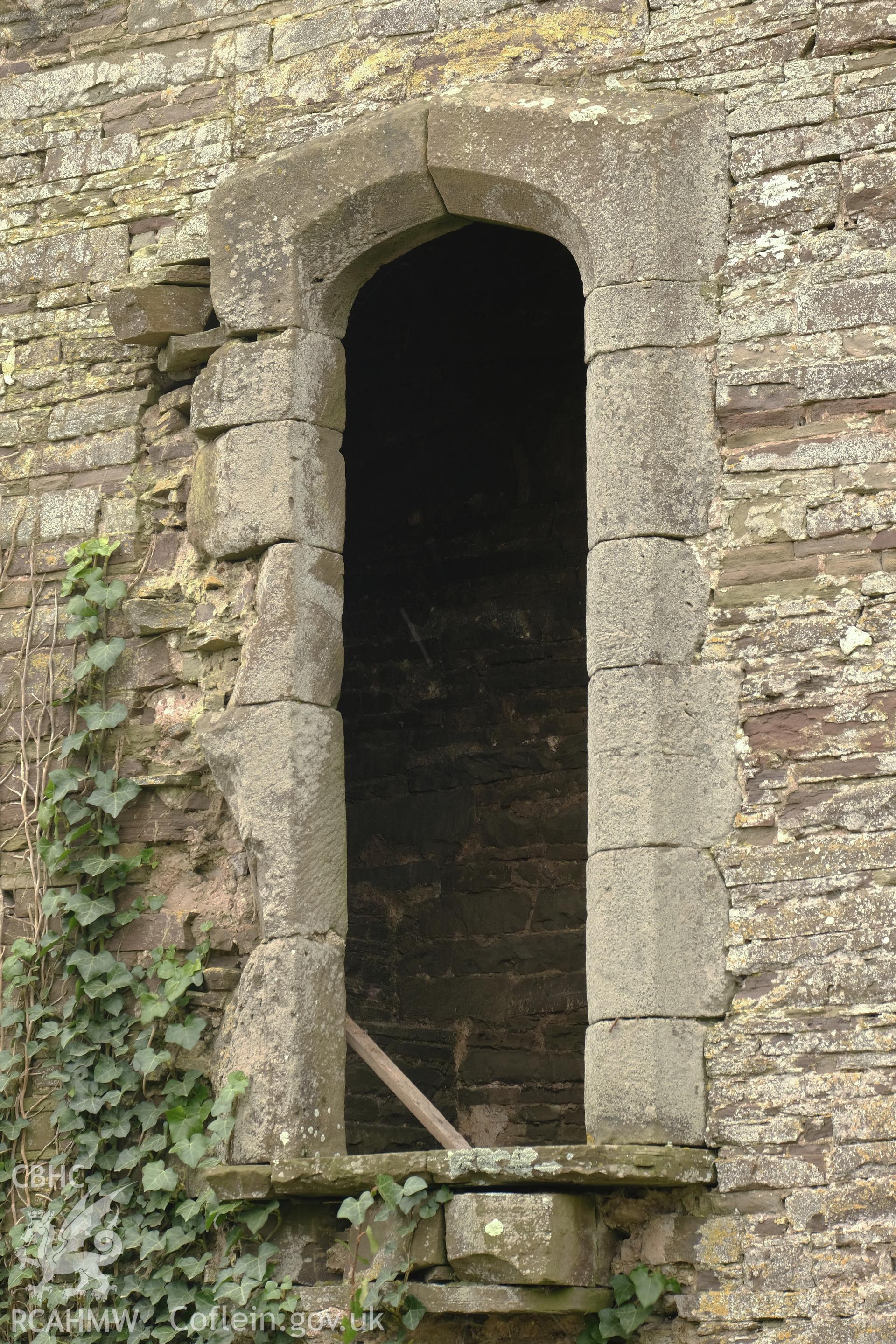 Colour photograph showing Great Porthmel Gatehouse - NE front, doorway to former wall walk, looking S. Produced as part of Historic Building Recording for Great Porthamel Gatehouse, carried out by Richard Hayman, April 2021.
