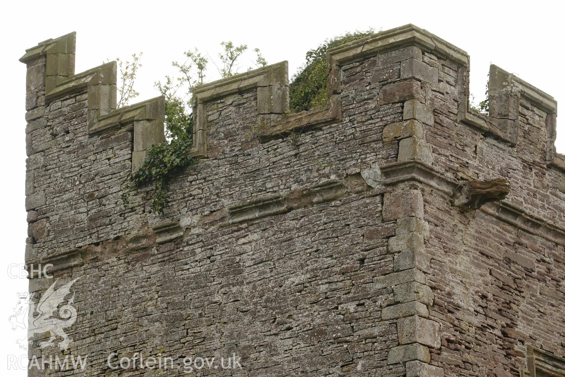 Colour photograph showing Great Porthmel Gatehouse - parapet, NE front, looking S. Produced as part of Historic Building Recording for Great Porthamel Gatehouse, carried out by Richard Hayman, April 2021.