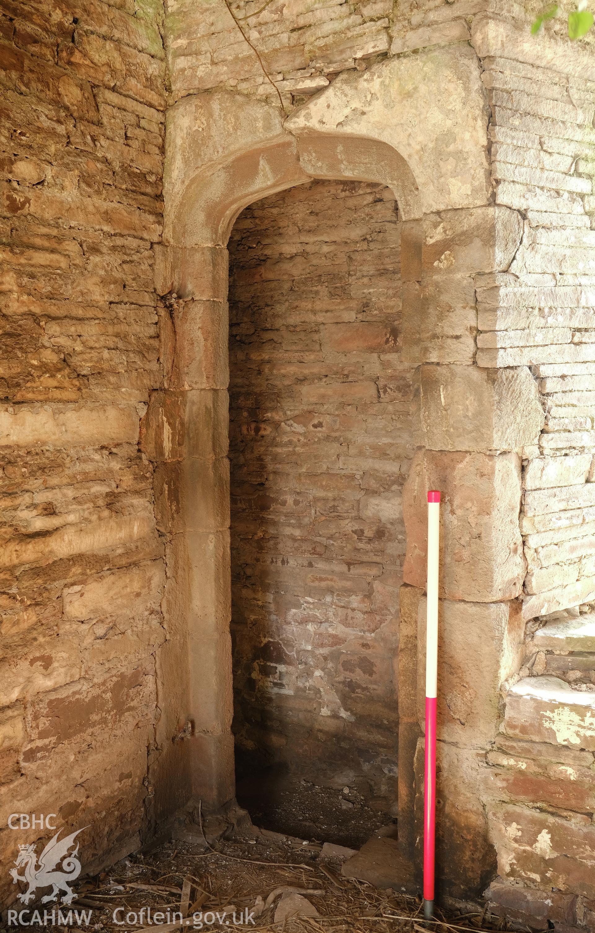 Colour photograph showing Great Porthmel Gatehouse - upper stage, doorway to lower stair, looking NE. Produced as part of Historic Building Recording for Great Porthamel Gatehouse, carried out by Richard Hayman, April 2021.