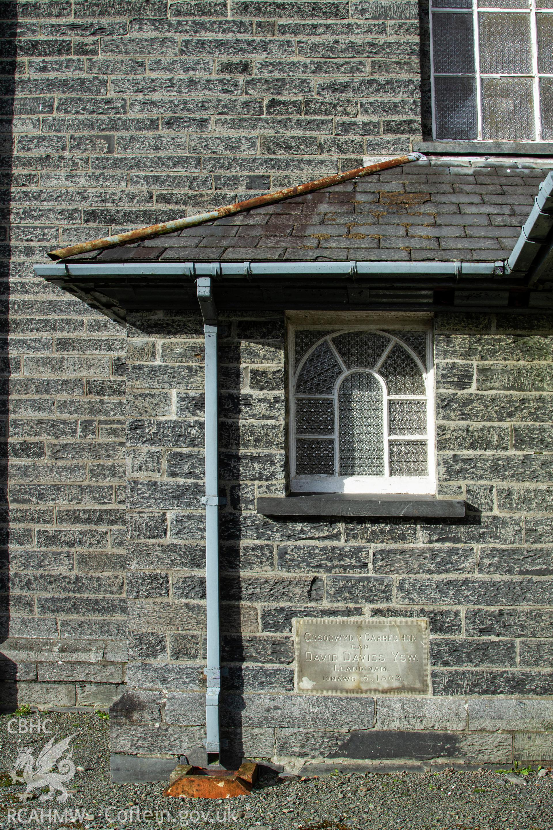Colour photograph of small window into entrance hall and date stone, left side, front of chapel  - part of a photographic survey of Bethania Chapel, Aberangell, Gwynedd, produced for John Linden by Adrian John Hexter as a condition of planning consent. (Planning Application Ref. No. NP5/74/L319). Snowdonia National Park Planning Authority.