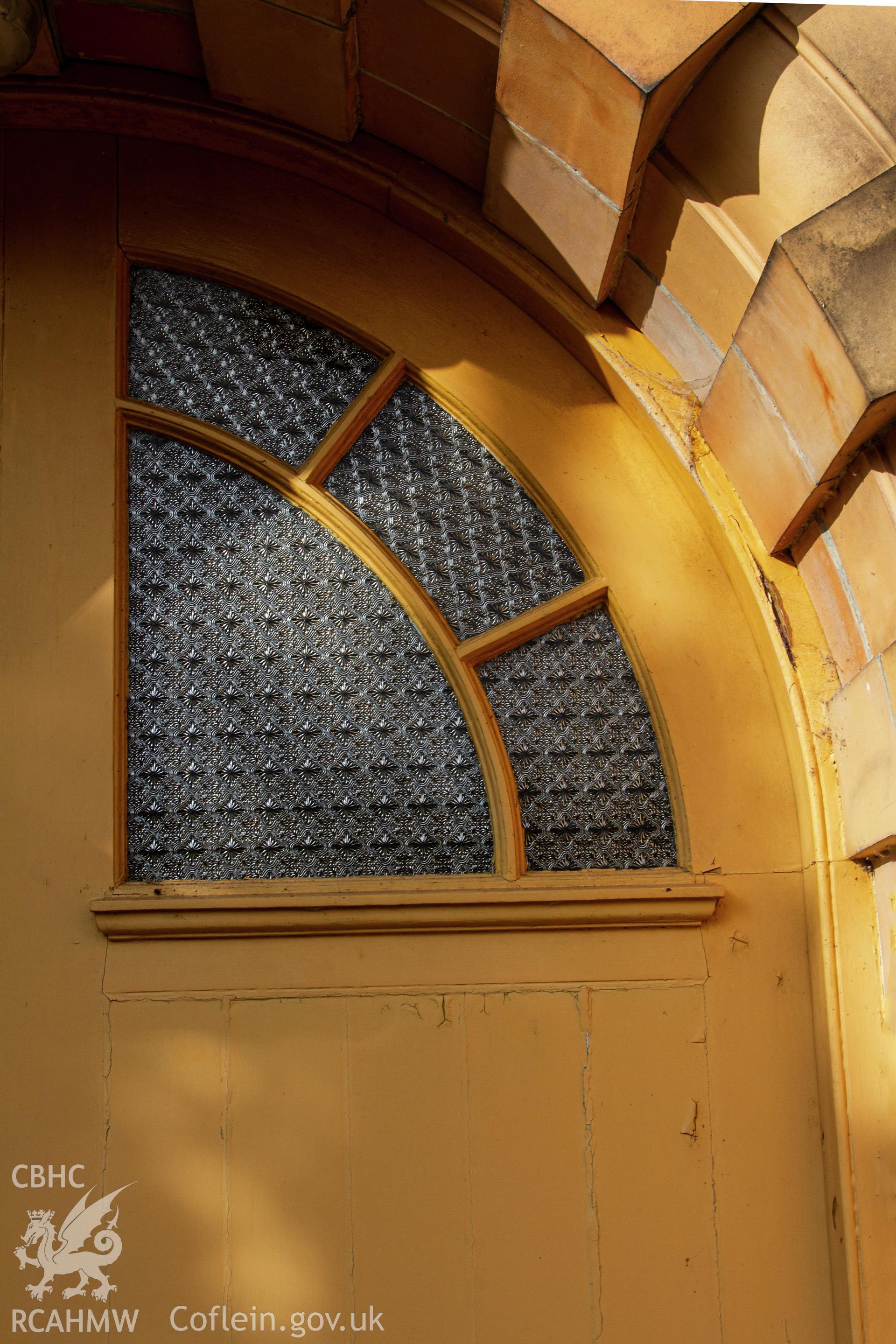 Colour photograph of detail of window in front door - part of a photographic survey of Bethania Chapel, Aberangell, Gwynedd, produced for John Linden by Adrian John Hexter as a condition of planning consent. (Planning Application Ref. No. NP5/74/L319). Snowdonia National Park Planning Authority.