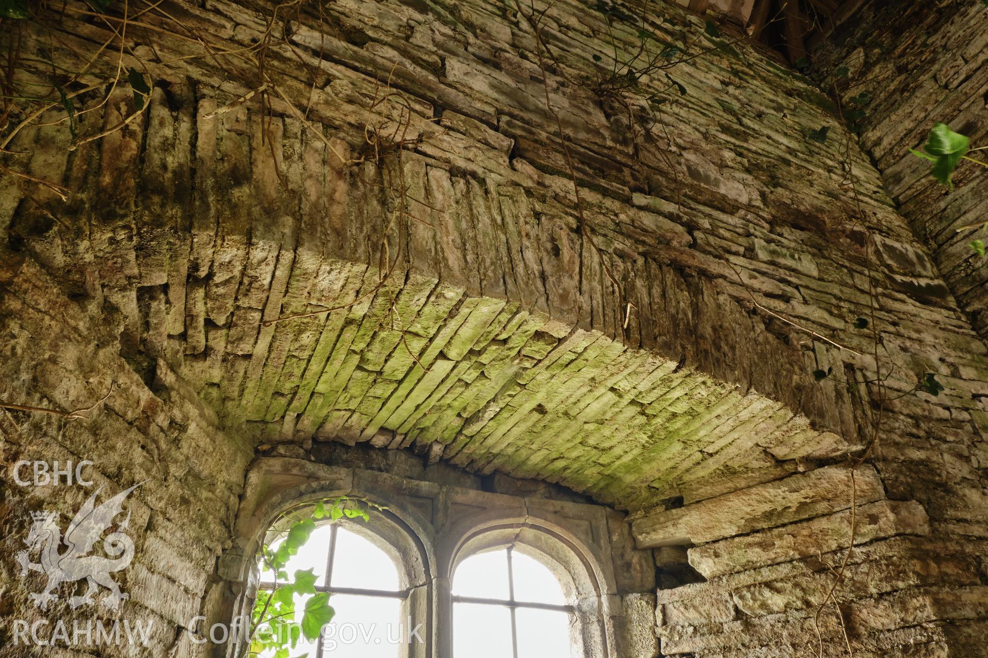 Colour photograph showing Great Porthmel Gatehouse - rear arch to upper stage window in NW front, looking N. Produced as part of Historic Building Recording for Great Porthamel Gatehouse, carried out by Richard Hayman, April 2021.