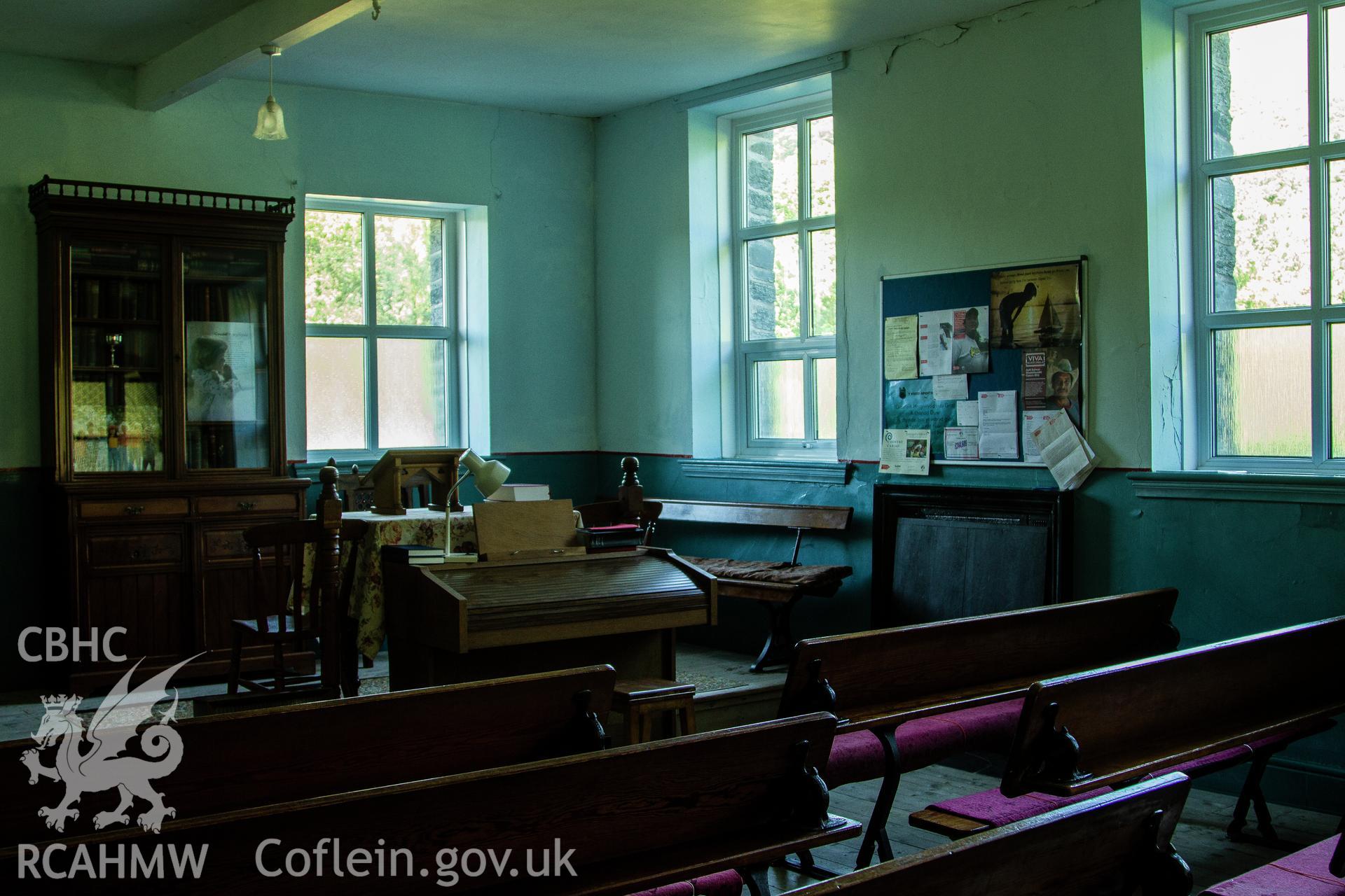 Colour photograph of interior of vestry where services were held when congregation had diminished - part of a photographic survey of Bethania Chapel, Aberangell, Gwynedd, produced for John Linden by Adrian John Hexter, as a condition of planning consent. (Planning Application Ref. No. NP5/74/L319). Snowdonia National Park Planning Authority.