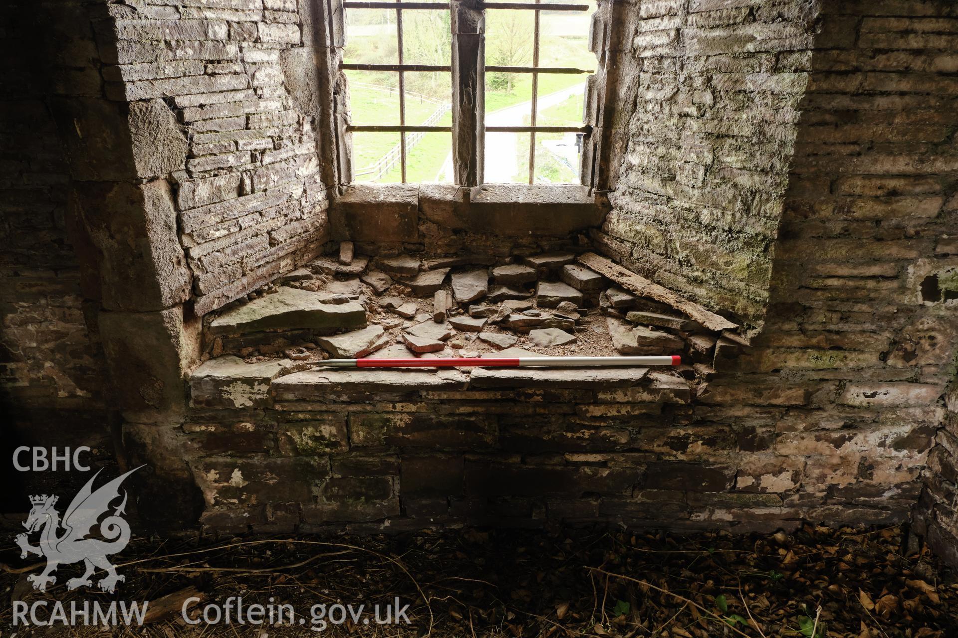 Colour photograph showing Great Porthmel Gatehouse - former window seat in upper stage SE window. Produced as part of Historic Building Recording for Great Porthamel Gatehouse, carried out by Richard Hayman, April 2021.
