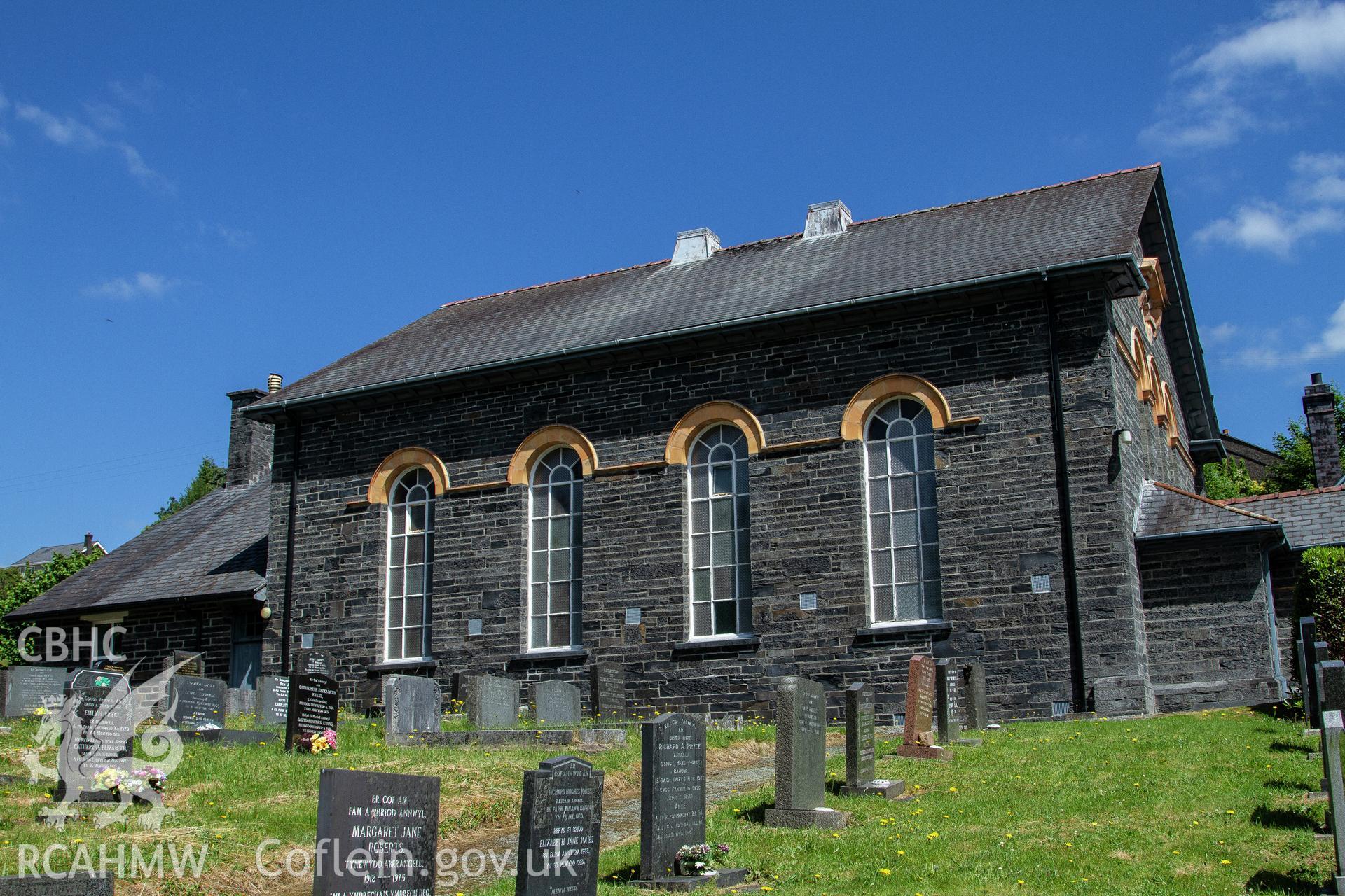 Colour photograph of exterior - chapel from the south - part of a photographic survey of Bethania Chapel, Aberangell, Gwynedd, produced for John Linden by Adrian John Hexter, as a condition of planning consent. (Planning Application Ref. No. NP5/74/L319). Snowdonia National Park Planning Authority.