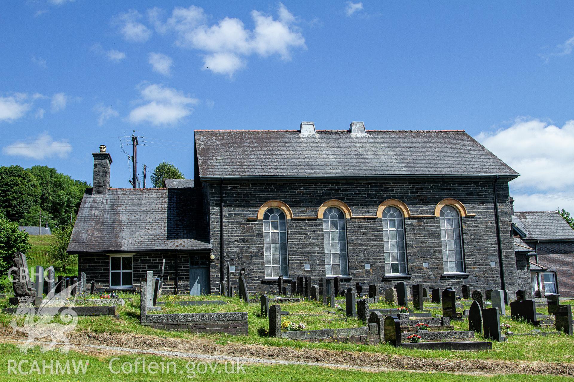 Colour photograph of exterior - chapel from the graveyard - part of a photographic survey of Bethania Chapel, Aberangell, Gwynedd, produced for John Linden by Adrian John Hexter, as a condition of planning consent. (Planning Application Ref. No. NP5/74/L319). Snowdonia National Park Planning Authority.