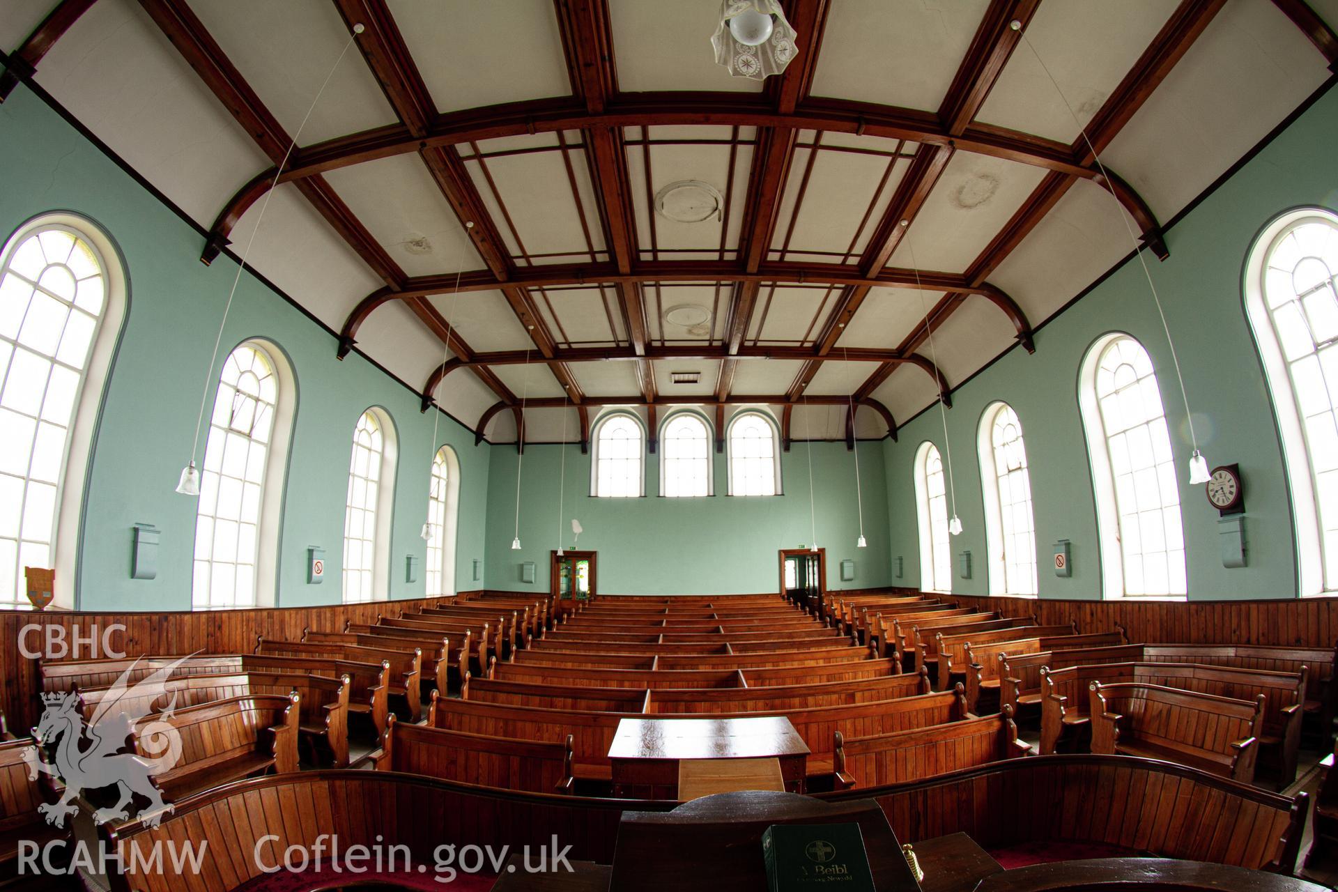 Colour photograph of interior - whole chapel view from pulpit - part of a photographic survey of Bethania Chapel, Aberangell, Gwynedd, produced for John Linden by Adrian John Hexter, as a condition of planning consent. (Planning Application Ref. No. NP5/74/L319). Snowdonia National Park Planning Authority.