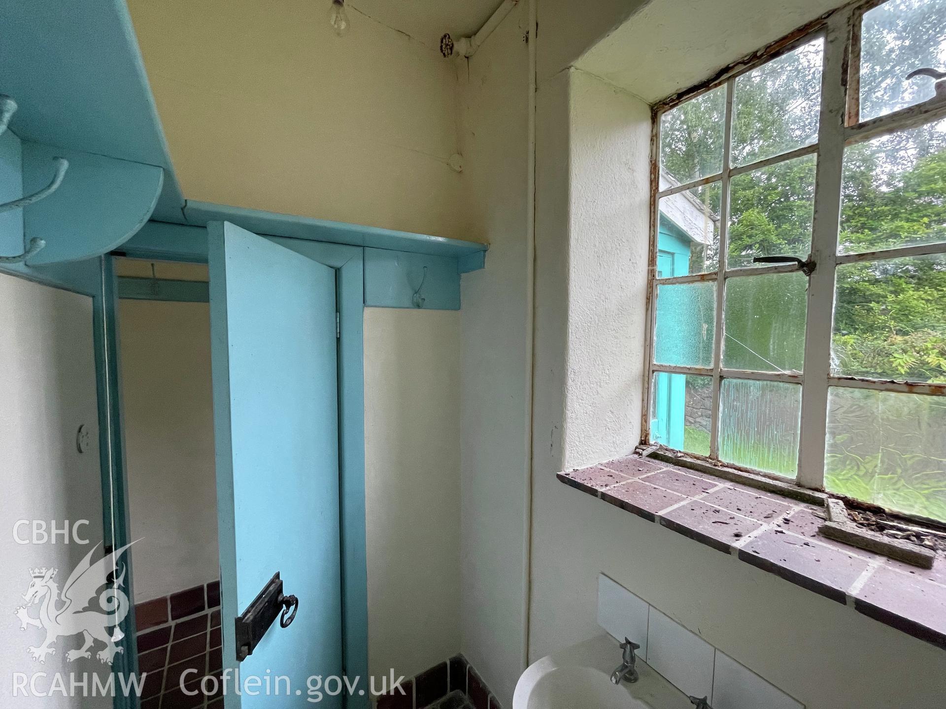 Colour photograph showing male lavatory facing east  - part of a photographic record relating to Moriah Chapel, Llanystumdwy, produced as a condition of planning consent (Planning Reference C21/0420/41/LL; Gwynedd Council).