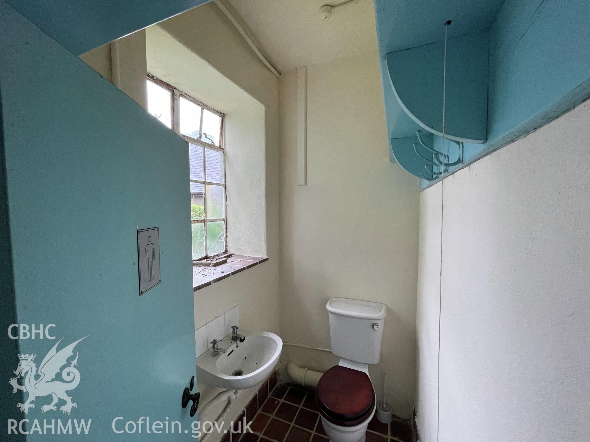 Colour photograph showing male lavatory facing west  - part of a photographic record relating to Moriah Chapel, Llanystumdwy, produced as a condition of planning consent (Planning Reference C21/0420/41/LL; Gwynedd Council).