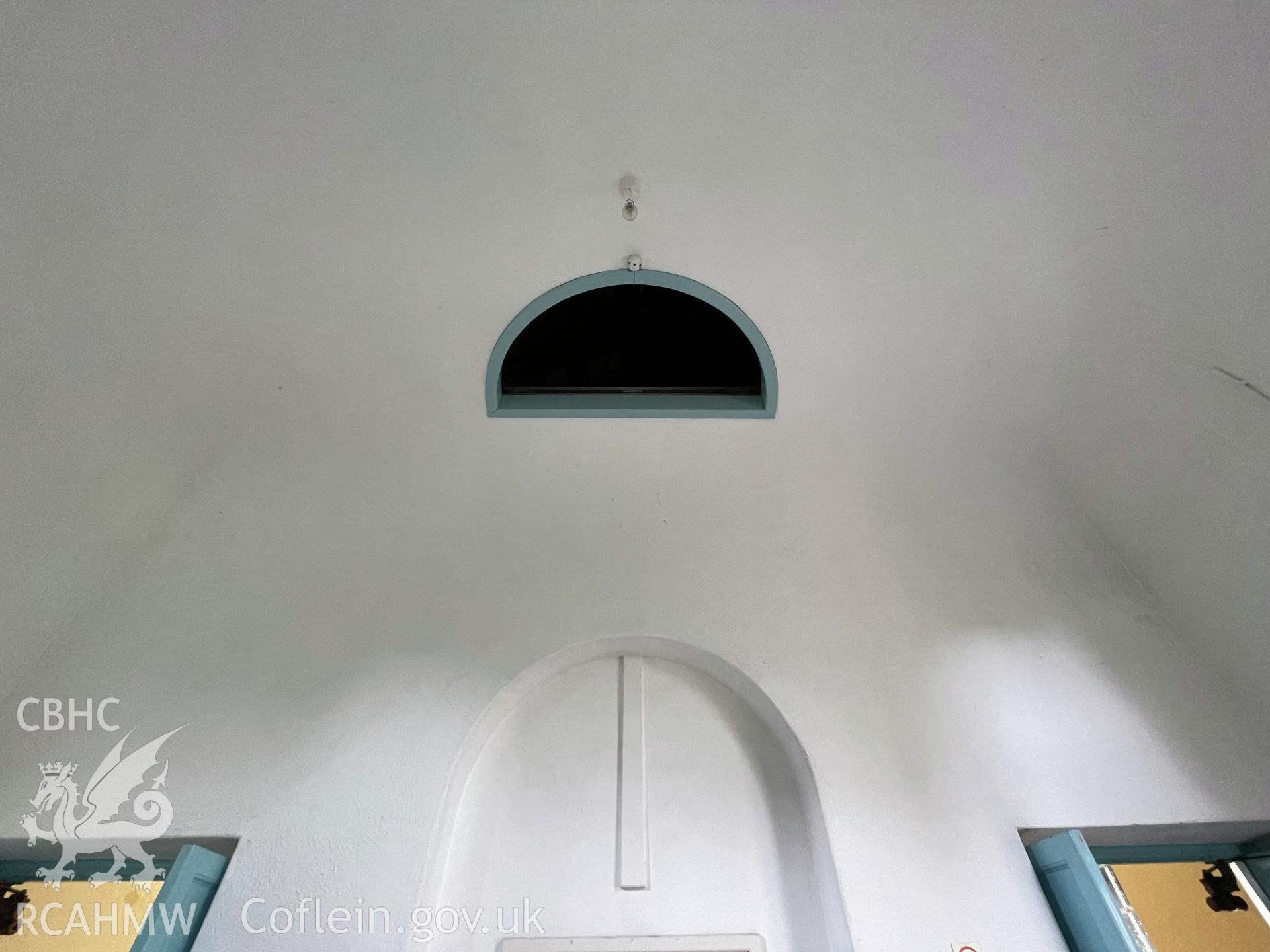 Colour photograph showing vestibule ceiling (facing north) - part of a photographic record relating to Moriah Chapel, Llanystumdwy, produced as a condition of planning consent (Planning Reference C21/0420/41/LL; Gwynedd Council).