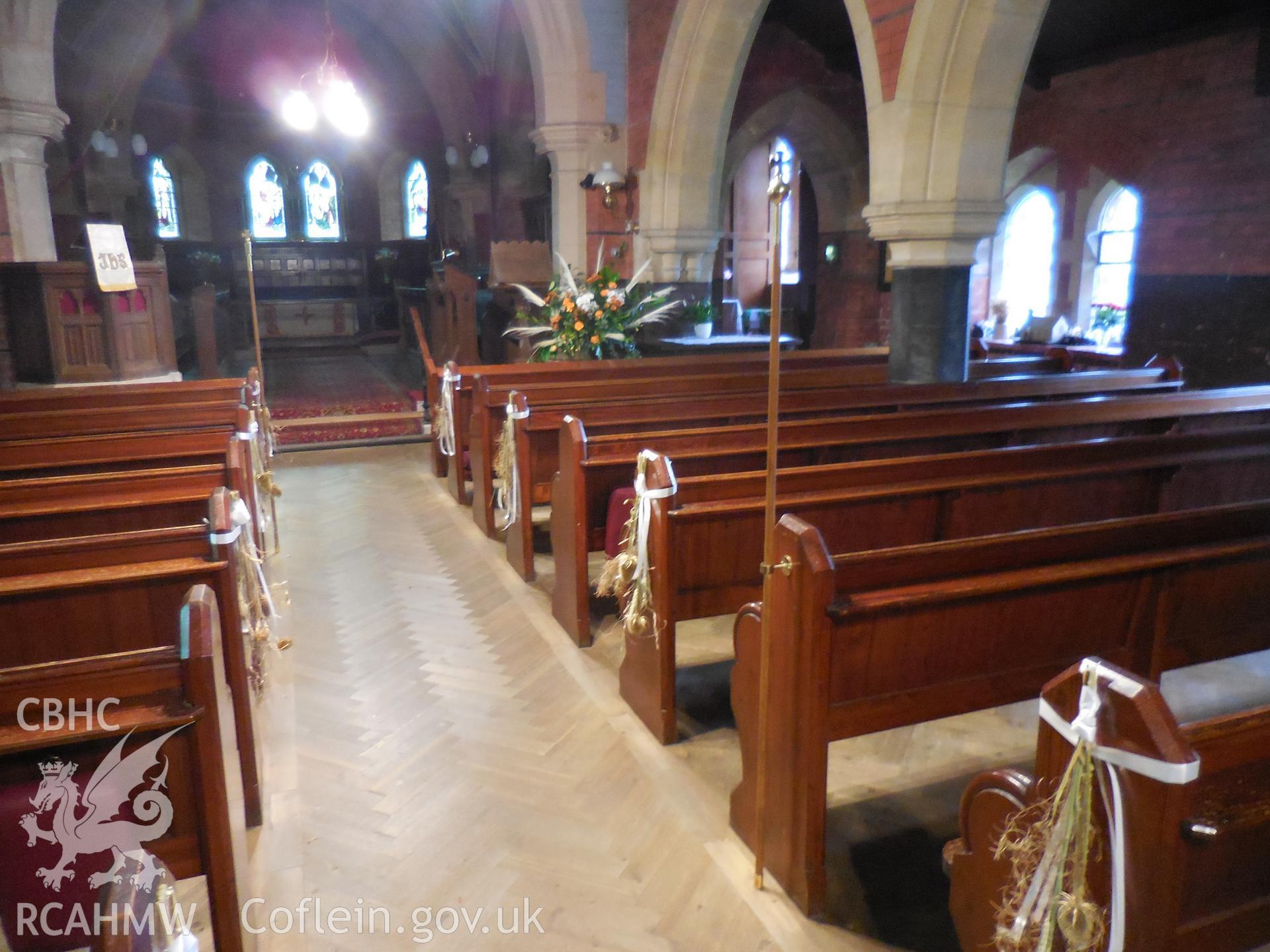 Colour digital photograph showing  interior of St Wyddyn's church during harvest festival 2021.