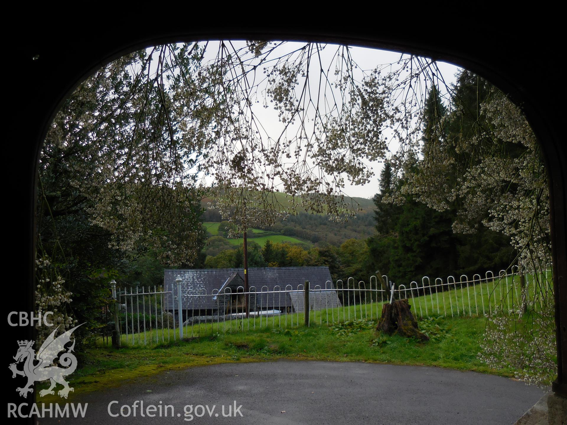 Colour digital photograph showing decorated porch at St Wyddyn's church, taken during harvest festival in October 2021.