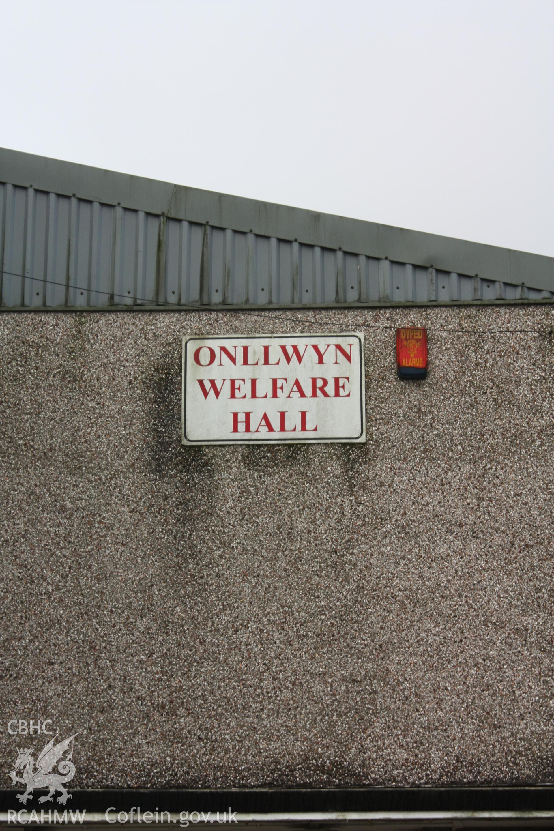 Colour photography showing the nameplate at Onllwyn Miners' Welfare Hall, taken by Nicola Roberts of RCAHMW in February 2022.