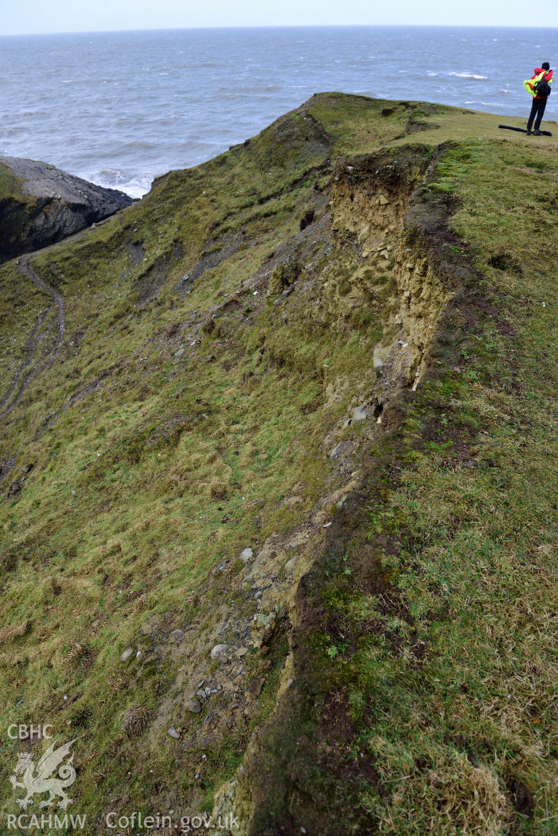 Top of eroding section edge of Castell Bach (NPRN 93914). Survey staff visible. Camera facing N. Taken by Daniel Hunt for the purpose of site monitoring 13/02/2018.
Produced with EU funds through the Ireland Wales Co-operation Programme 2014-2020. All material made freely available through the Open Government Licence.