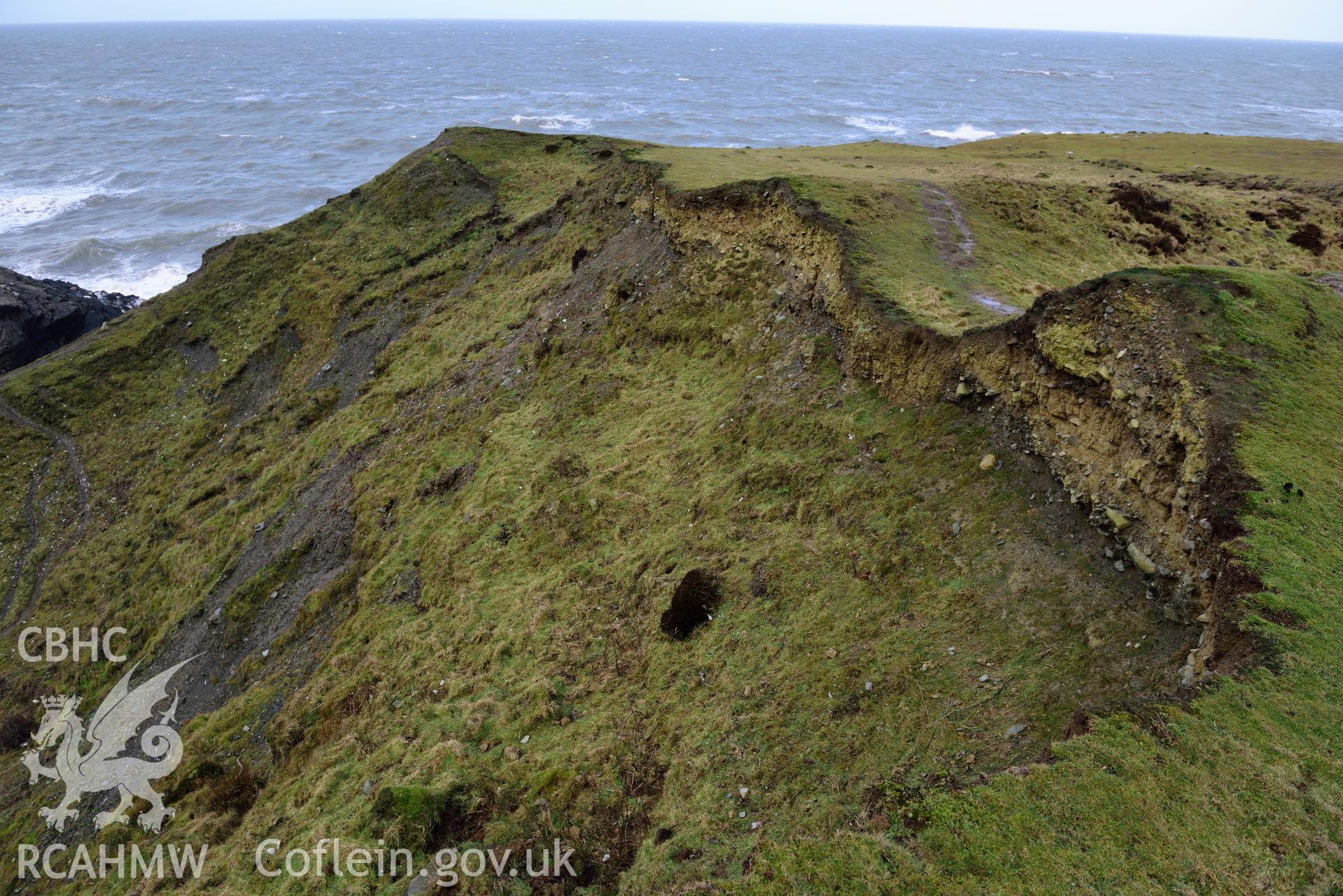 Eroding section edge of Castell Bach (NPRN 93914). Camera facing N. Taken by Daniel Hunt for the purpose of site monitoring 13/02/2018.
Produced with EU funds through the Ireland Wales Co-operation Programme 2014-2020. All material made freely available through the Open Government Licence.