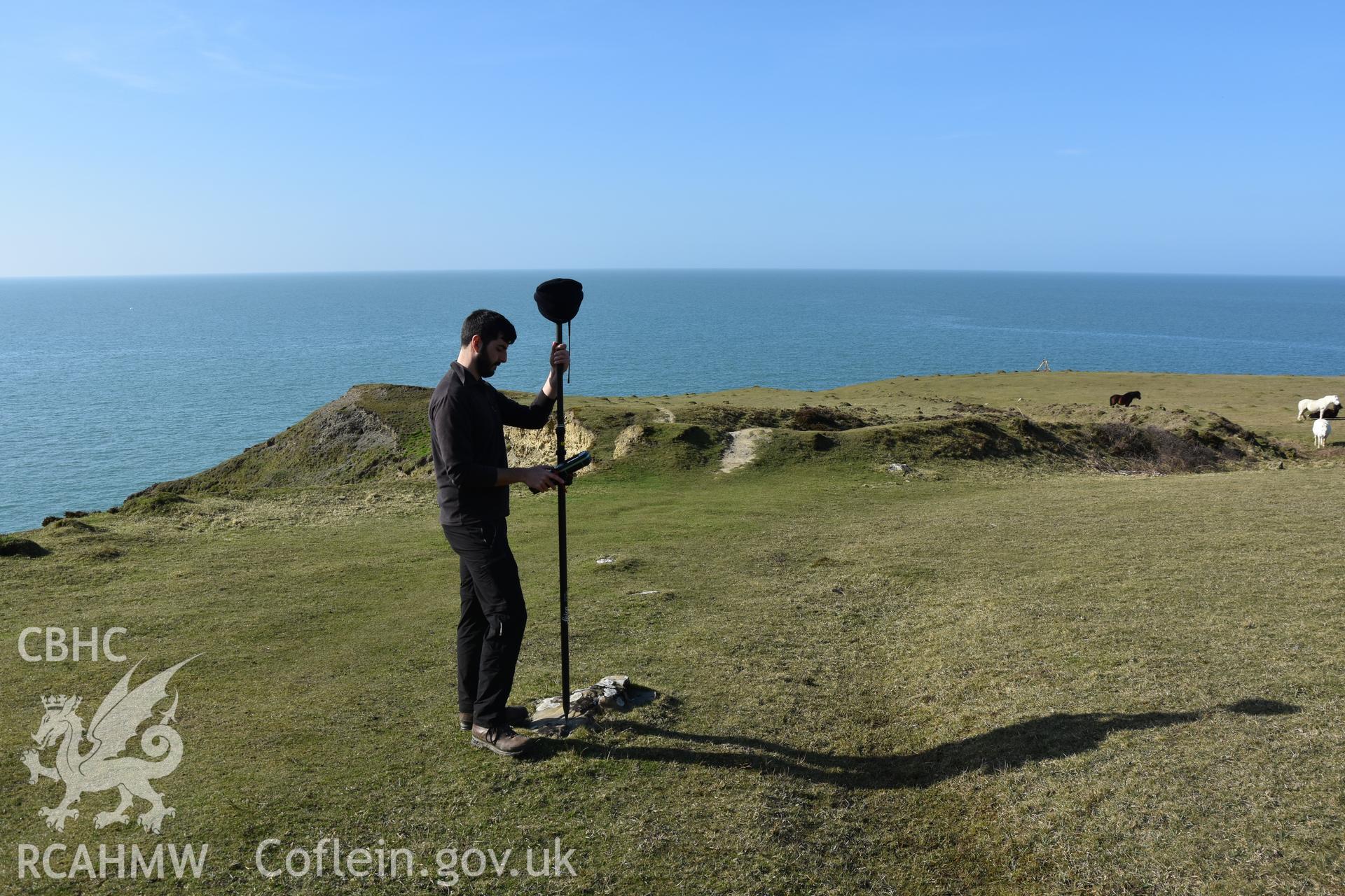 CHERISH project team measuring location of survey marker with ramparts and horses in background. Camera facing N. hotographic survey of Castell Bach (NPRN 93914) by Dr Toby Driver for site monitoring 27/03/2019.
Produced with EU funds through the Ireland Wales Co-operation Programme 2014-2020. All material made freely available through the Open Government Licence.