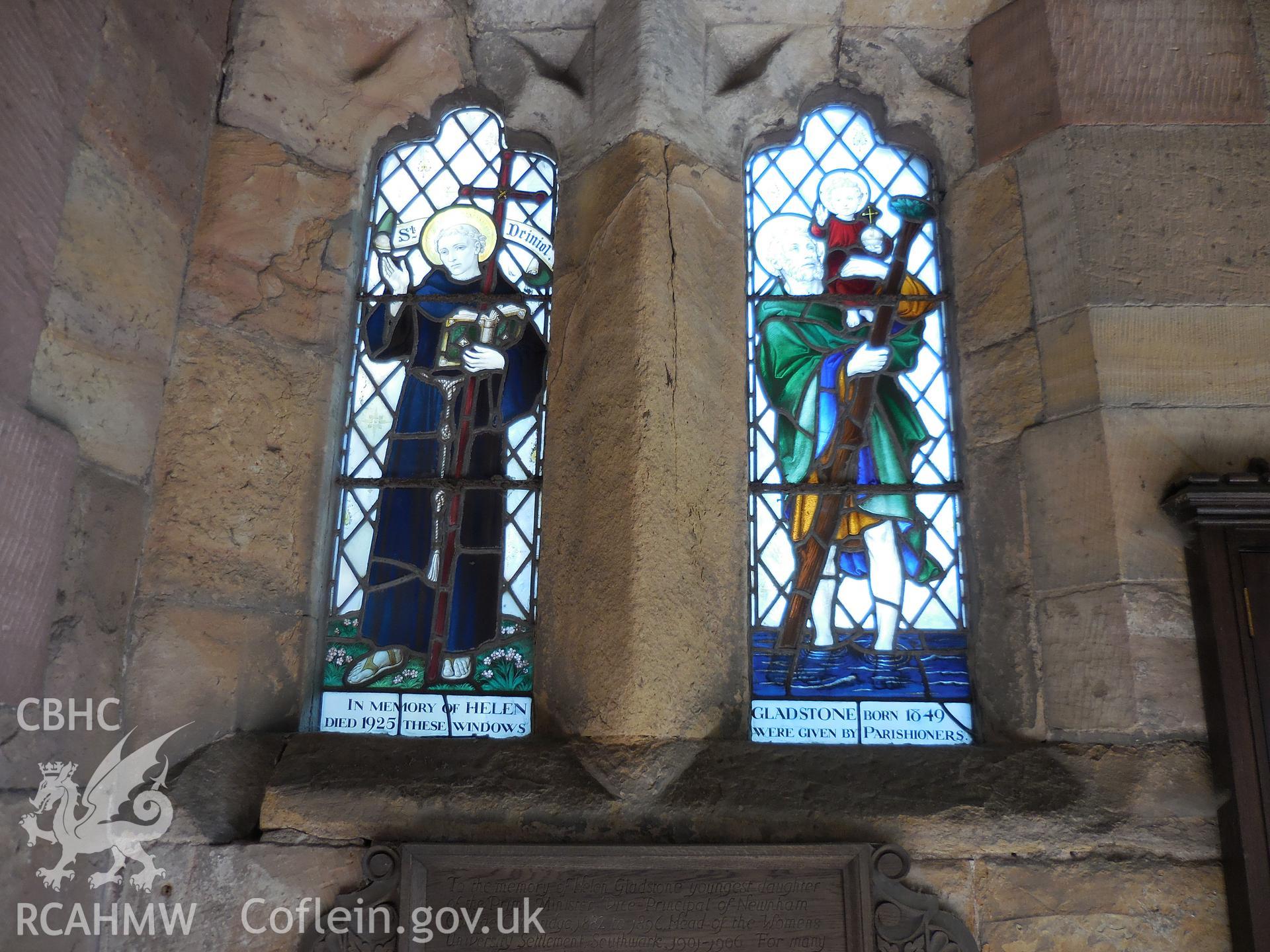 Colour digital photograph showing pair of 1928 stained glass windows dedicated to Helen Gladstone at St Deiniol's church, Hawarden, taken in March 2022.