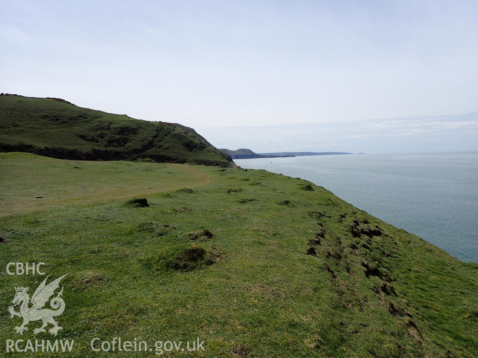 View of coast facing W. From photographic survey of Castell Bach promontory fort (NPRN 93914) by Daniel Hunt for CHERISH project condition monitoring 27/05/2021.
Produced with EU funds through the Ireland Wales Co-operation Programme 2014-2020. All material made freely available through the Open Government Licence.