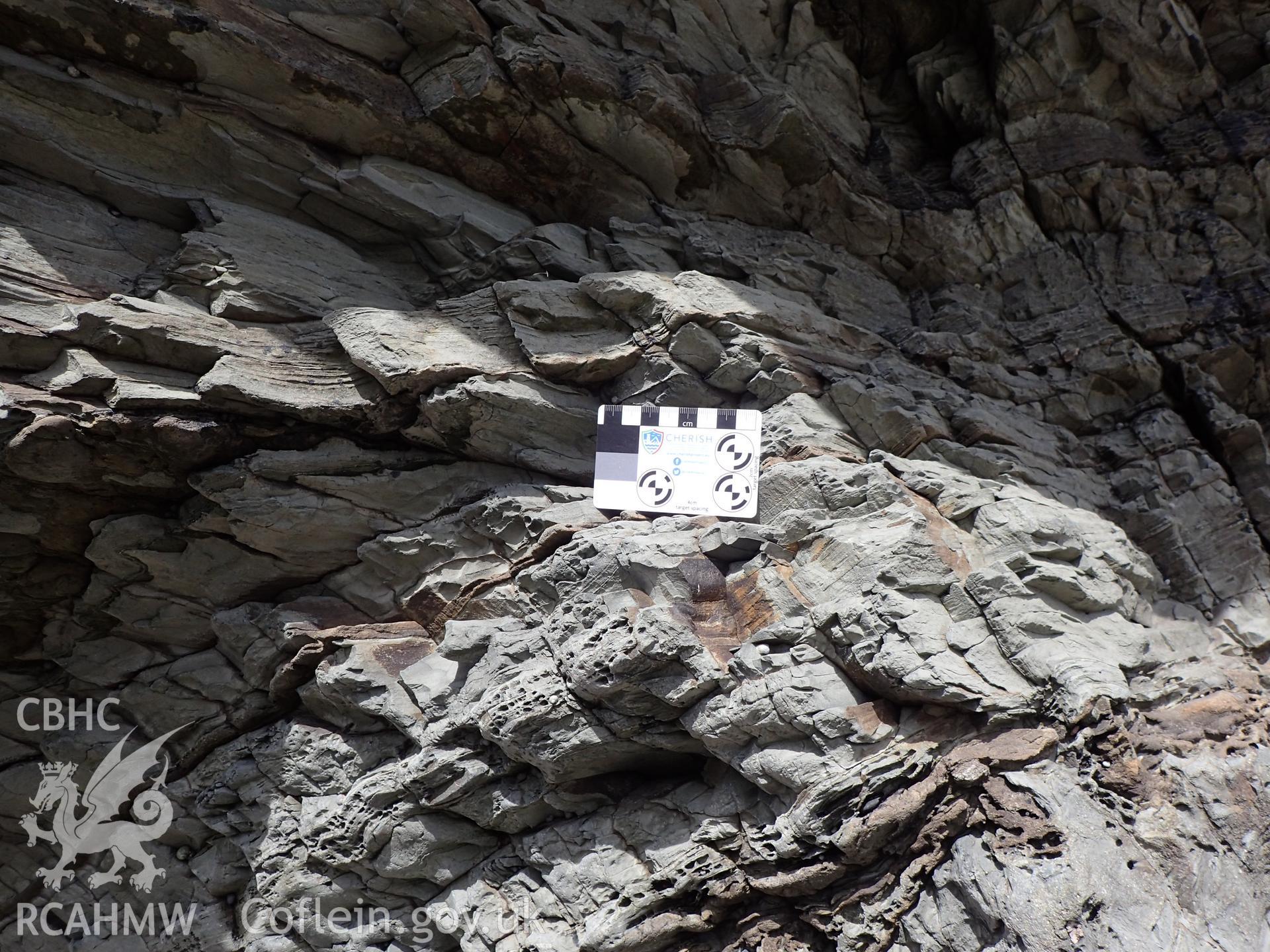 Close up of cliff with target. From photographic survey of Castell Bach promontory fort (NPRN 93914) by Daniel Hunt for CHERISH project condition monitoring 27/05/2021.
Produced with EU funds through the Ireland Wales Co-operation Programme 2014-2020. All material made freely available through the Open Government Licence.