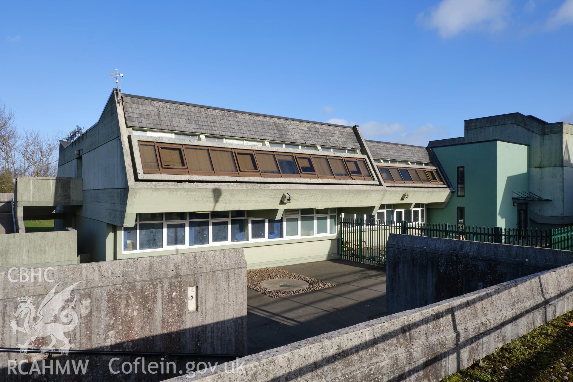 Colour photograph showing Argoed School - N classroom wing W front looking SE.
