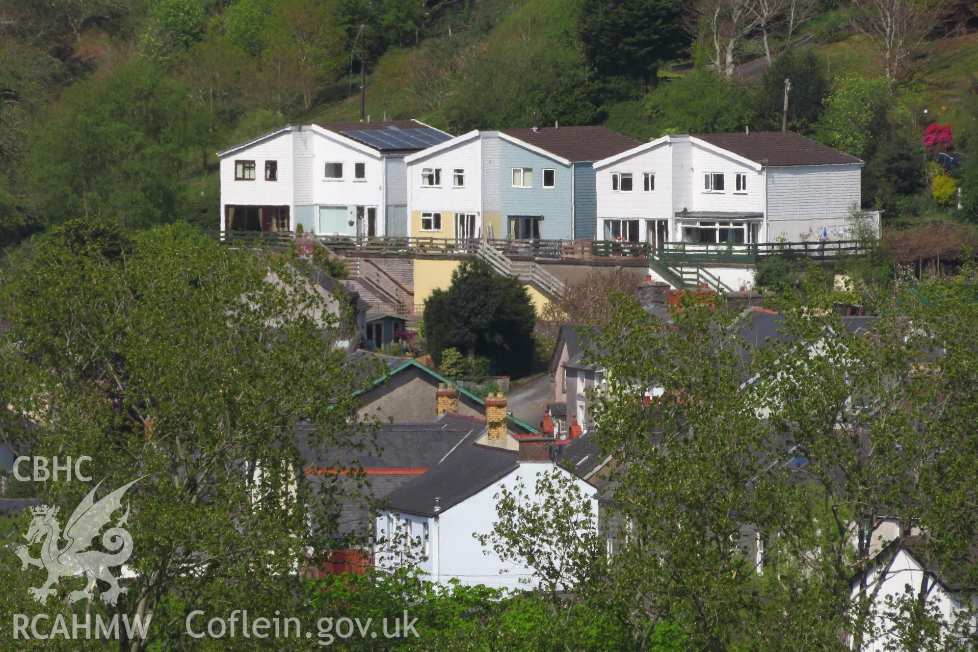 View of 1-6 Penrallt Estate, Machynlleth, from the south west, taken from Cae-Gybi Footpath on 27 April 2022.