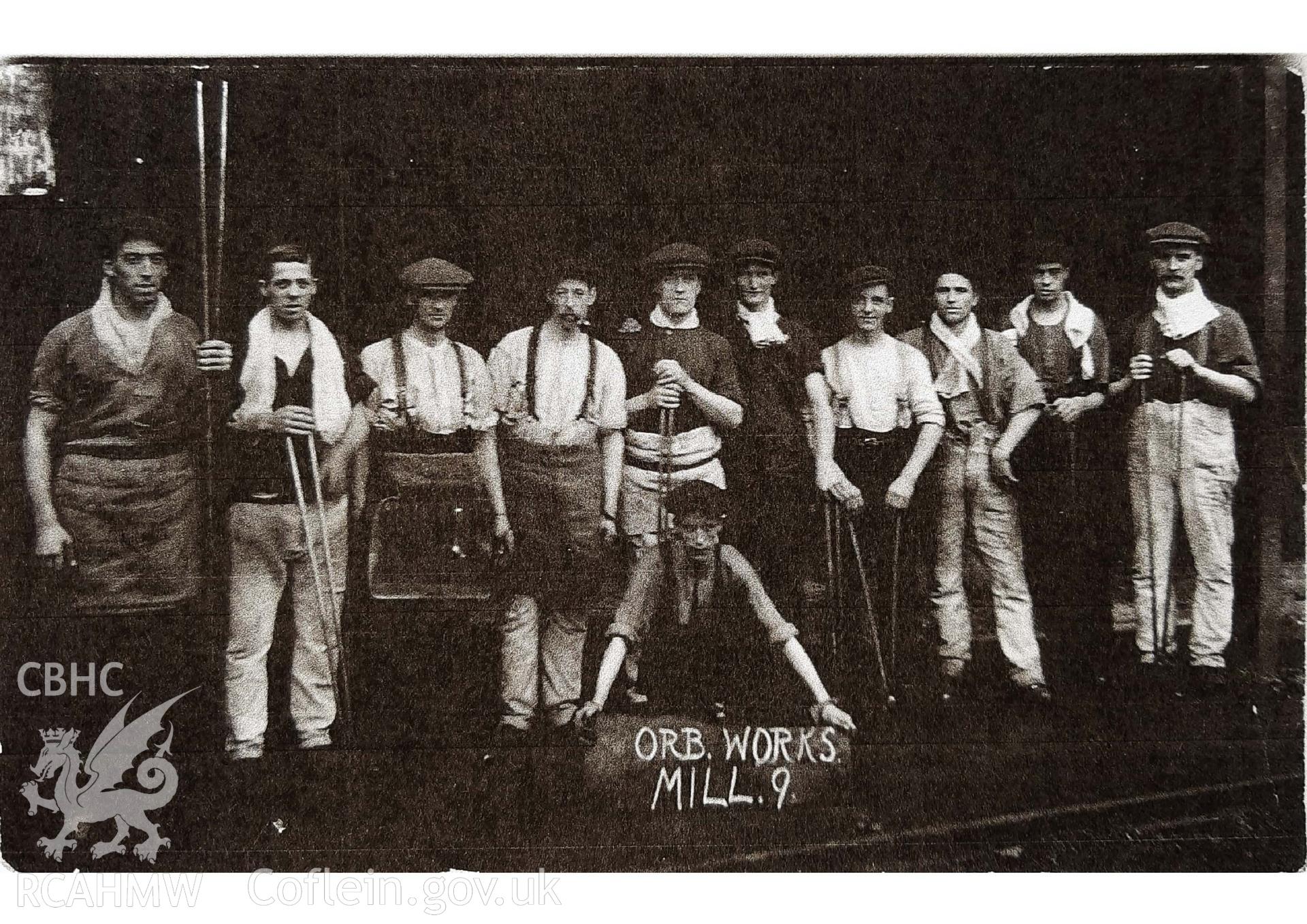A digital copy of a photograph of workers at Mill 9 at the Orb Steelworks, Newport, taken in about 1910.