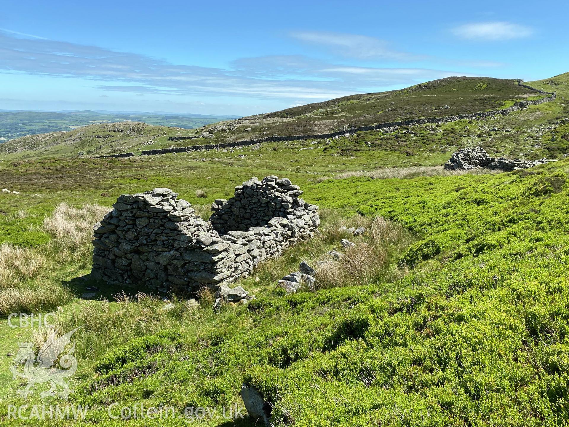 Digital colour photograph showing buildings near peat house at Ffriddlys, produced by Paul R Davis in 2021.