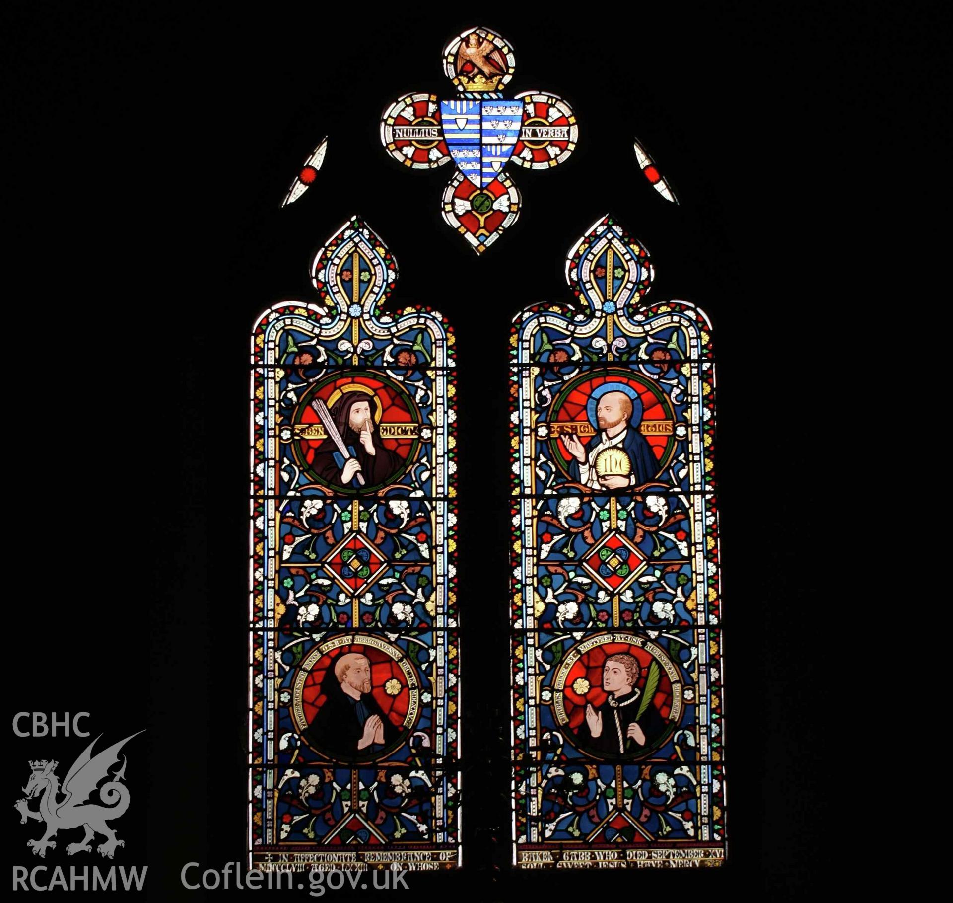 Digital colour photograph showing a stained glass window depicting St Benedict and St Ignatius as well as the Ven. Augustine Baker and St David Lewis (‘Charles Baker’); it is dedicated to John Baker Gabb. The window is in the chantry at Our Lady and St Michael Catholic church, Abergavenny.