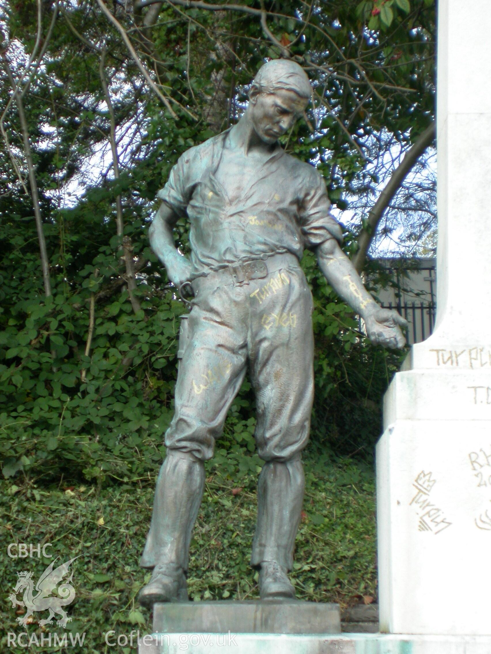 Detailed view of male figure on the Merthyr Tydfil War Memorial in Pontmorlais, Merthyr Tydfil. Produced by Geoff Ward of RCAHMW.