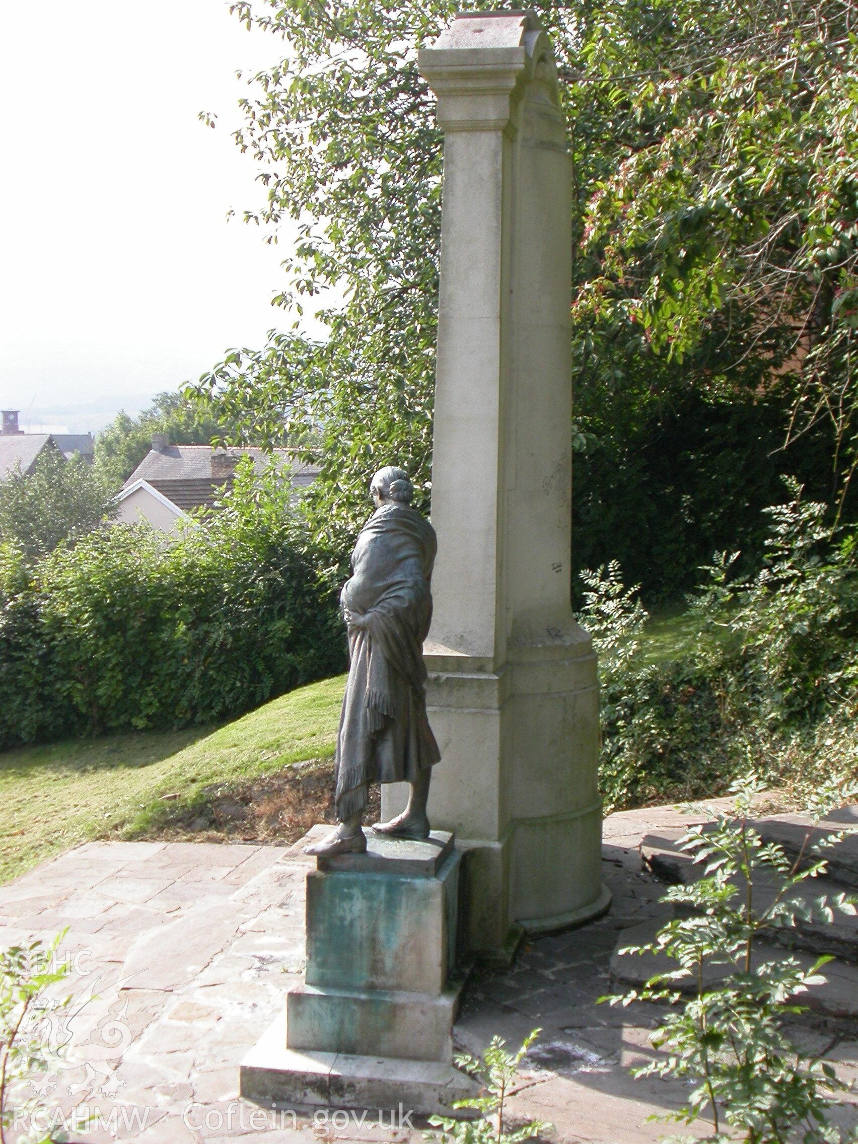 View from rear of the Merthyr Tydfil War Memorial (with female figure visible) in Pontmorlais, Merthyr Tydfil. Produced by Geoff Ward of RCAHMW.