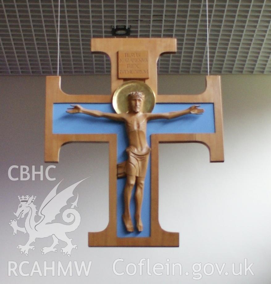 Digital colour photograph showing suspended timber cross at All Hallows Catholic church, Miskin.