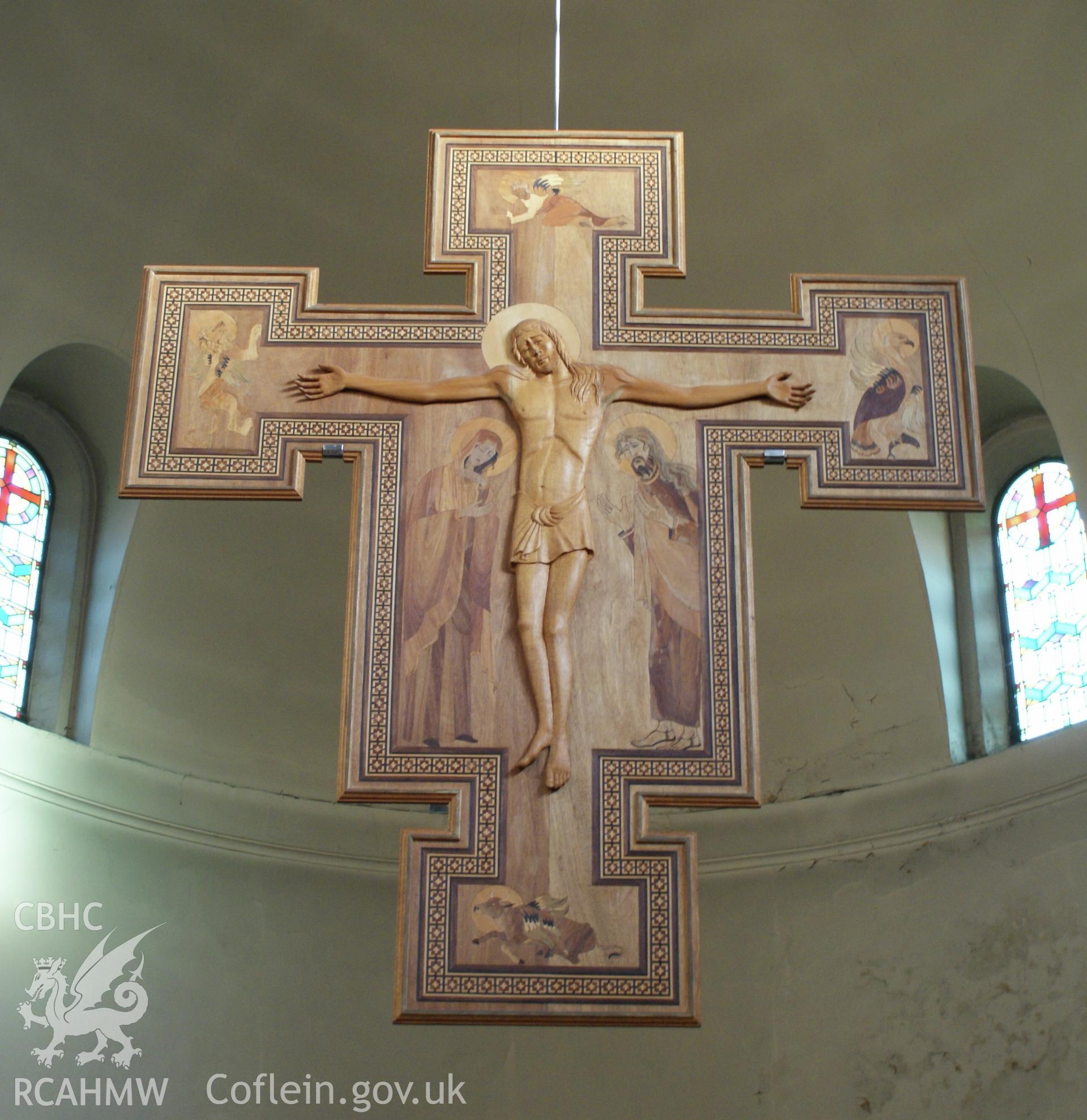 Digital colour photograph showing the life-size sanctuary crucifix by Penanne Crabbe (1999), at St Dyfrig's Catholic church, Treforest.
