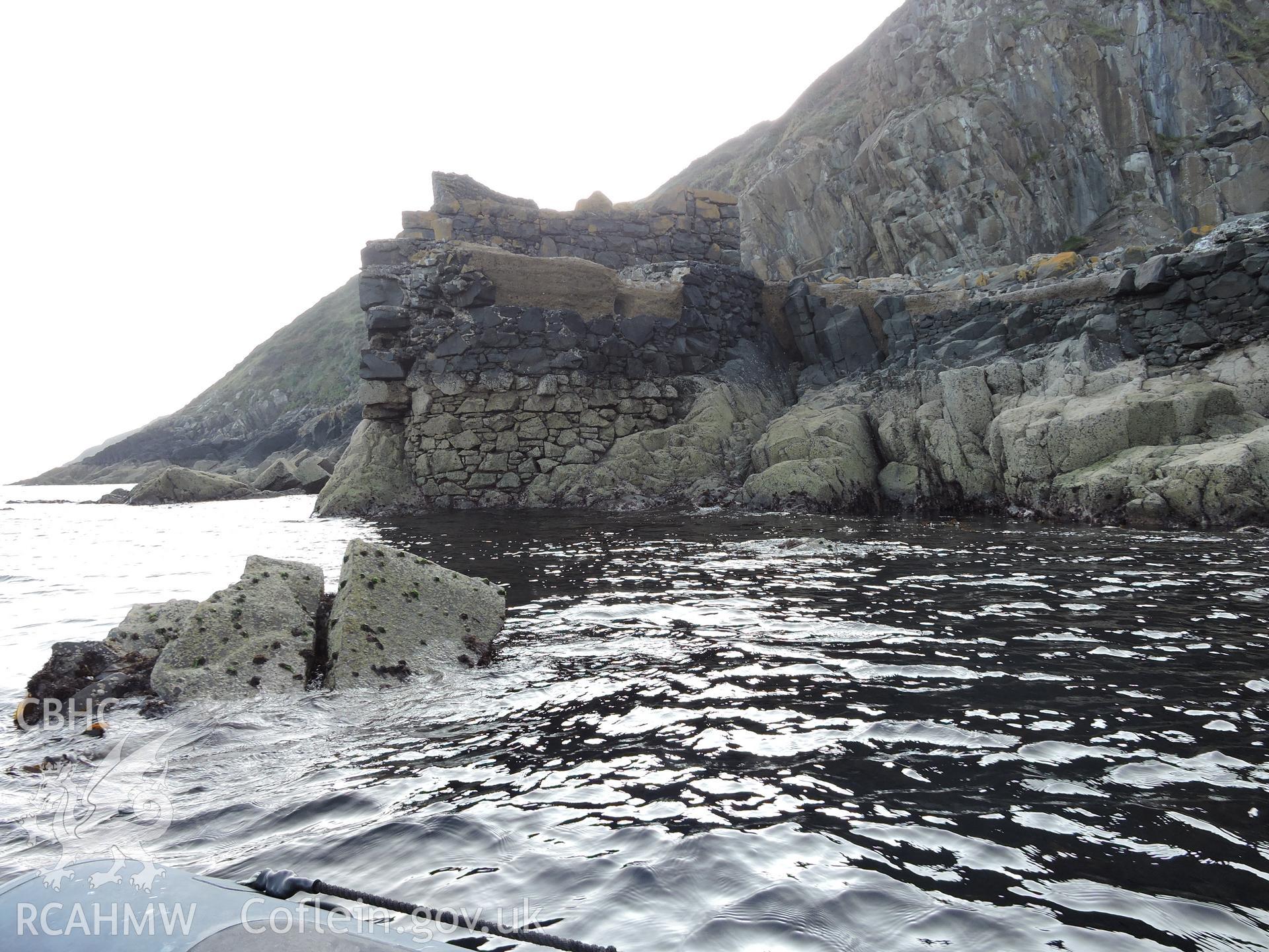 Detailed view of the remains of the quay's stone wall, as seen from sea level. Part of a digital photographic survey of Porth y Pistyll, Aberdaron, produced in 2020 by Michael Statham.