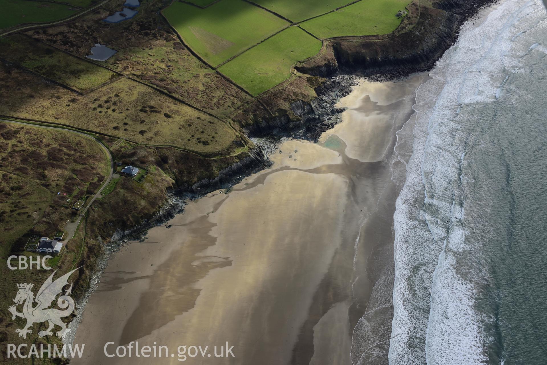 Aerial photography of the remains of the GUIDING STAR in the surf line at Whitesands. Baseline aerial reconnaissance survey for the CHERISH Project. C. Crown: CHERISH PROJECT 2017. Produced with EU funds through the Ireland Wales Co-operation Programme 2014-2020. All material made freely available through the Open Government Licence.