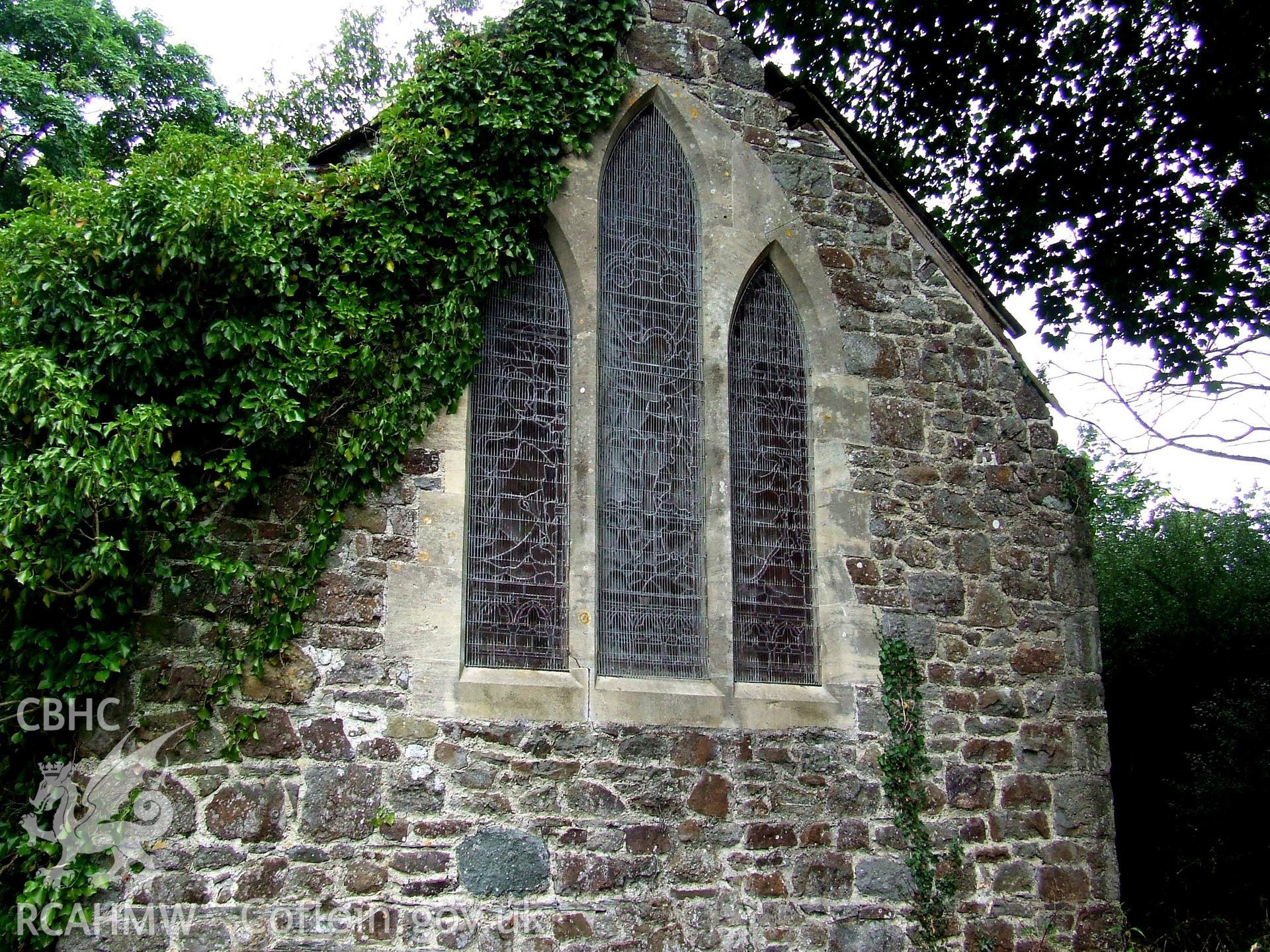 Digital colour photograph showing east end exterior of Castell Dwyran church.