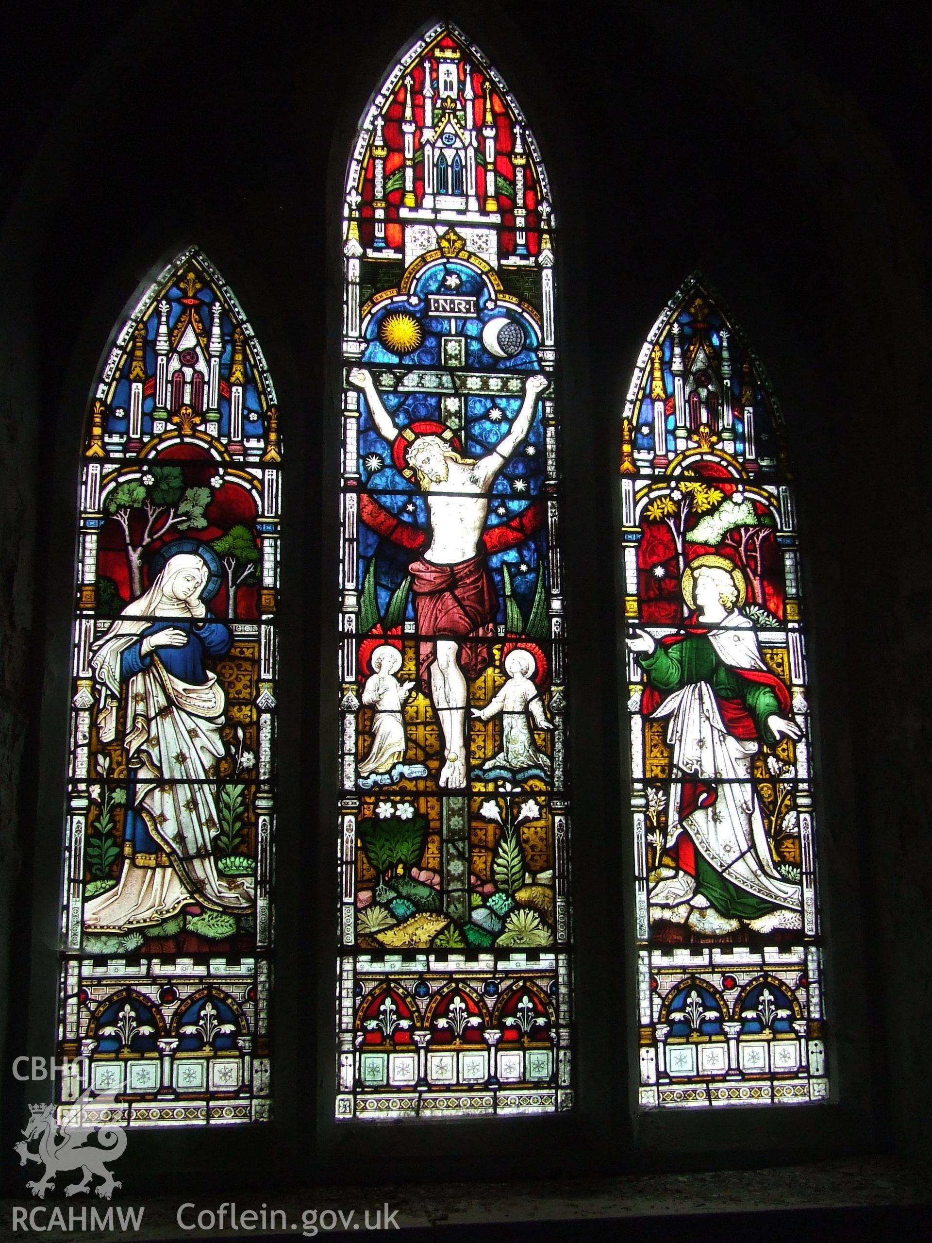 Digital colour photograph showing interior - stained glass east window, Castell Dwyran church.