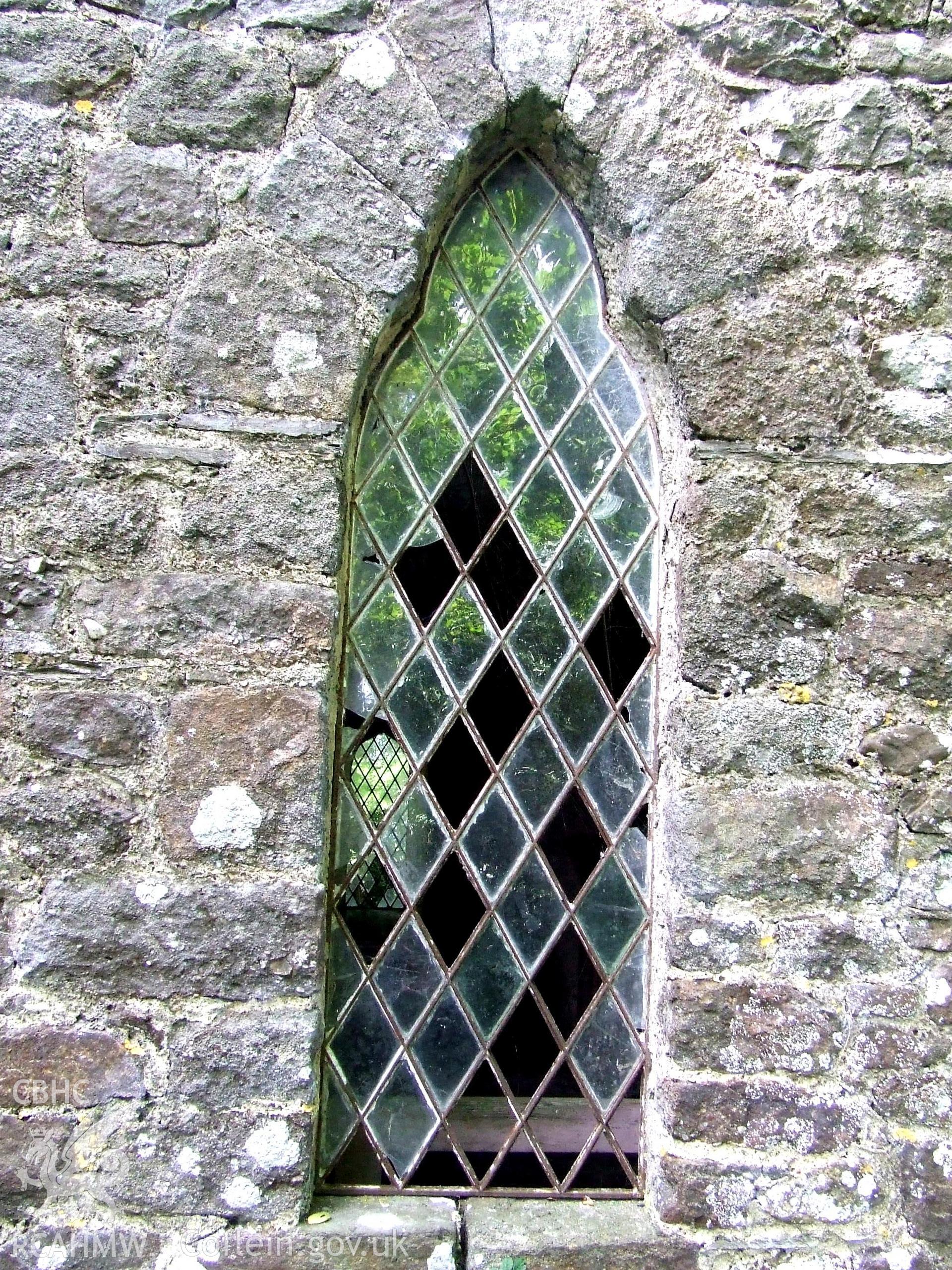 Digital colour photograph showing exterior - window detail (S transept), Castell Dwyran church.