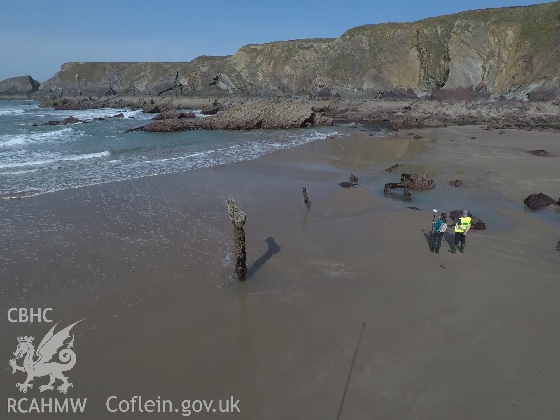 Pole camera shot of CHERISH team surveying the Albion paddle steamer shipwreck, exposed on the beach at low tide Taken by Daniel Hunt. Produced with EU funds through the Ireland Wales Co-operation Programme 2014-2023. All material made freely available th