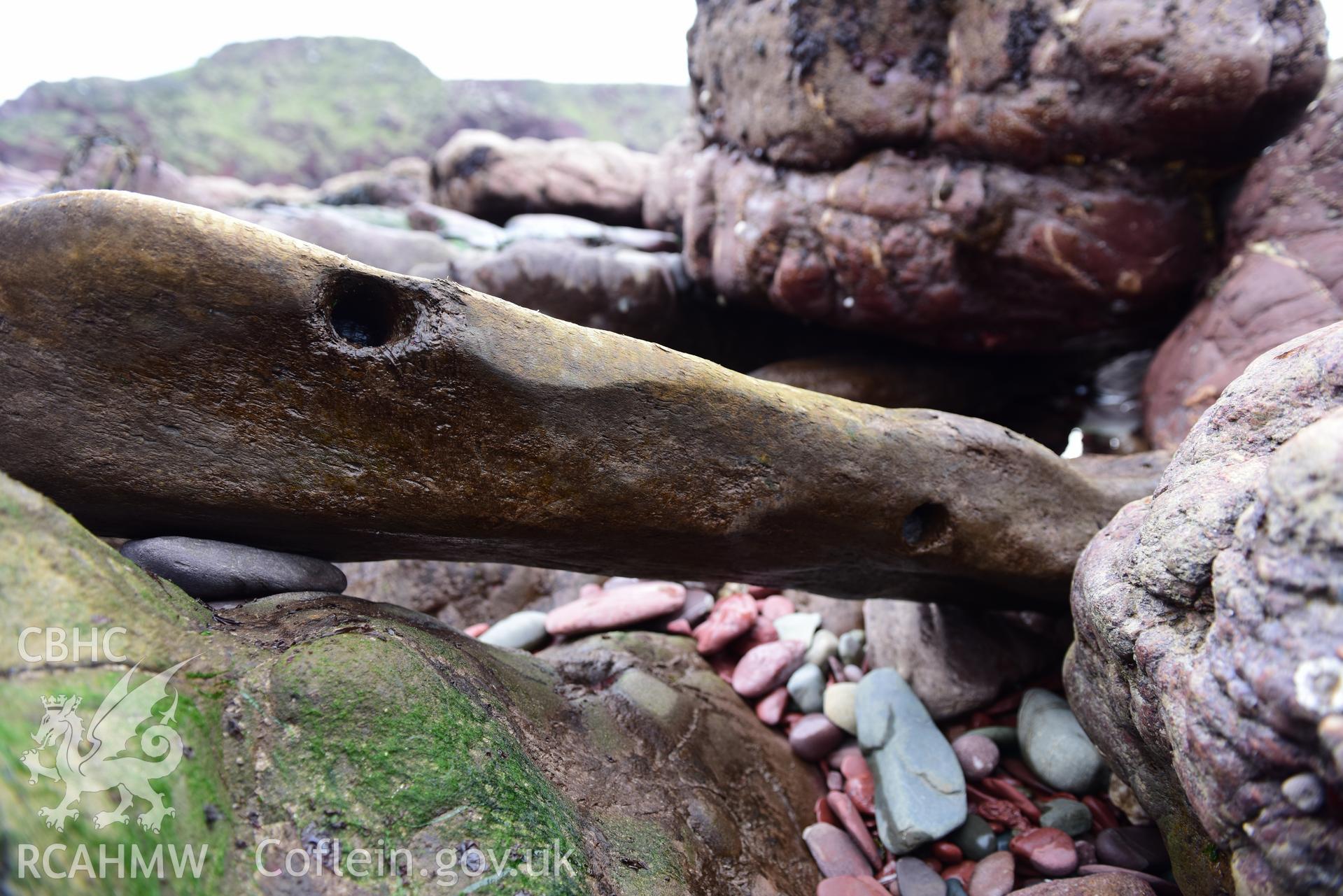 Close up shot of wood from the wreck Taken by Toby Driver. Produced with EU funds through the Ireland Wales Co-operation Programme 2014-2023. All material made freely available through the Open Government Licence.