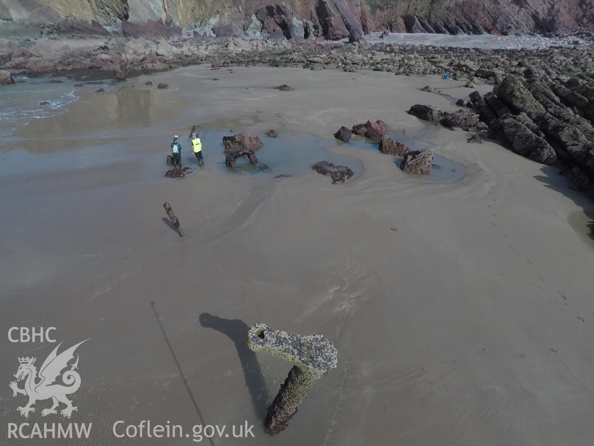 Pole camera shot of CHERISH team surveying the Albion paddle steamer shipwreck, exposed on the beach at low tide Taken by Daniel Hunt. Produced with EU funds through the Ireland Wales Co-operation Programme 2014-2023. All material made freely available th