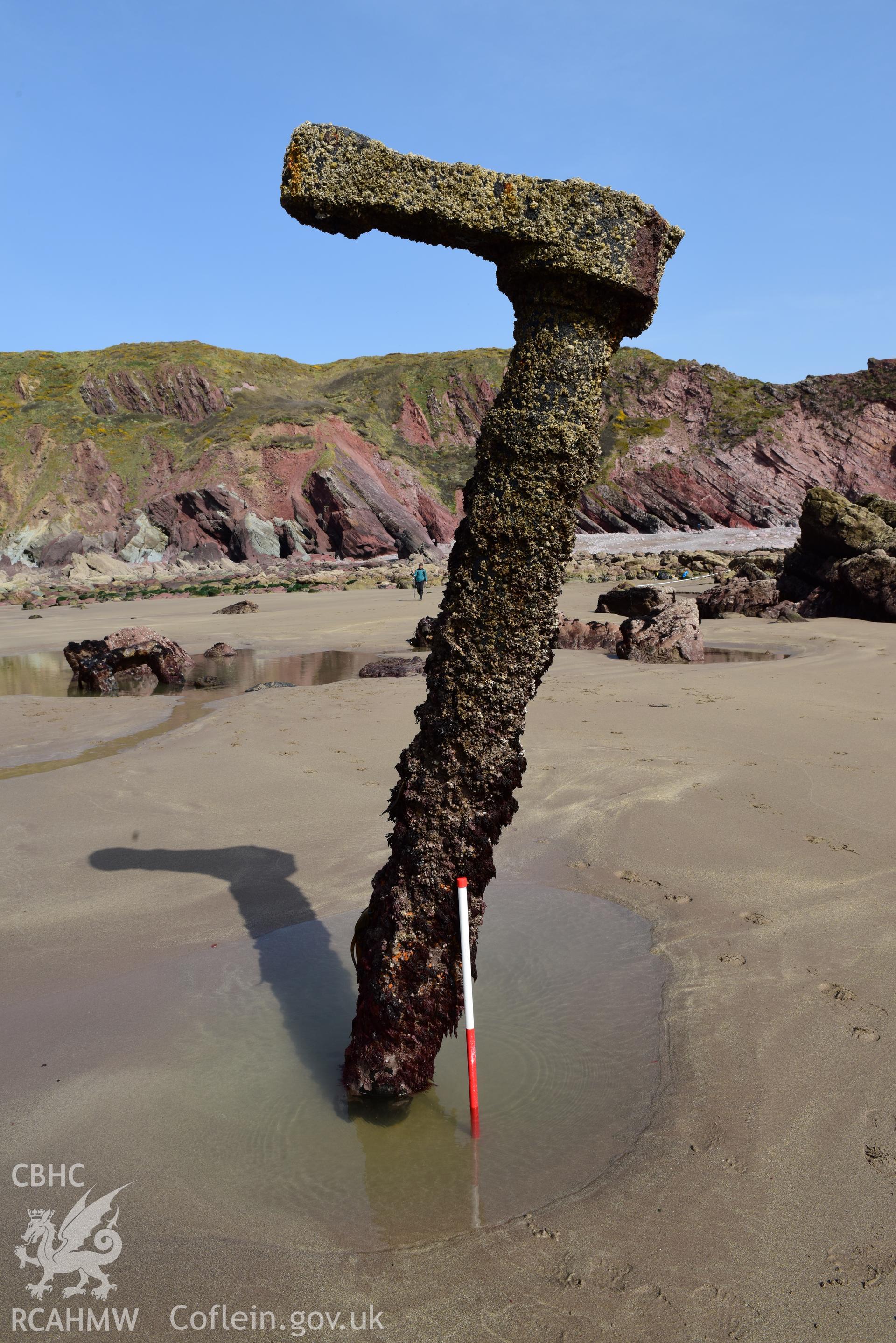 Part of the wreck upstanding in the sand with 1m scale. Taken by Toby Driver. Produced with EU funds through the Ireland Wales Co-operation Programme 2014-2023. All material made freely available through the Open Government Licence.