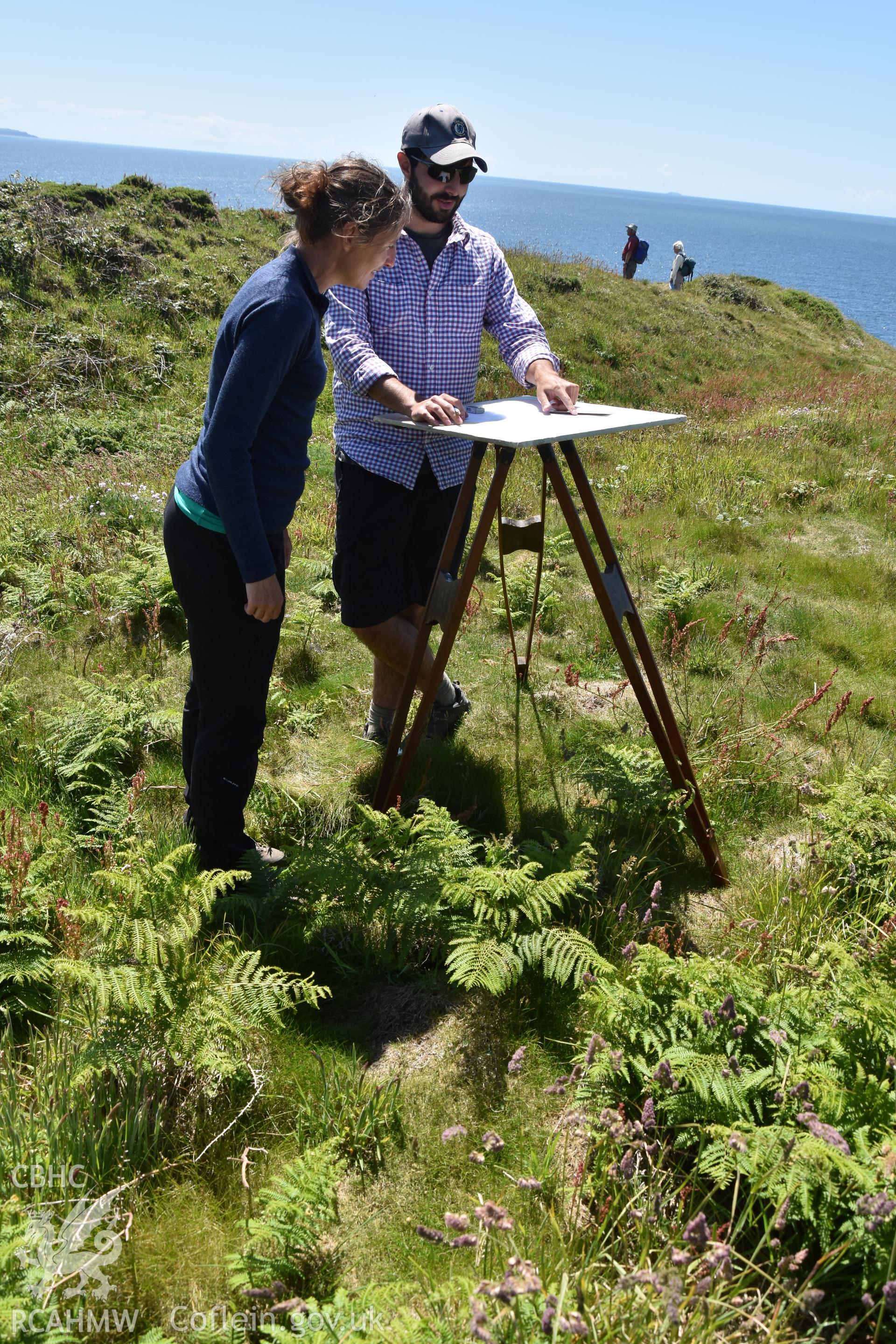 CHERISH team undertaking plane table survey Taken by Toby Driver. Produced with EU funds through the Ireland Wales Co-operation Programme 2014-2023. All material made freely available through the Open Government Licence.