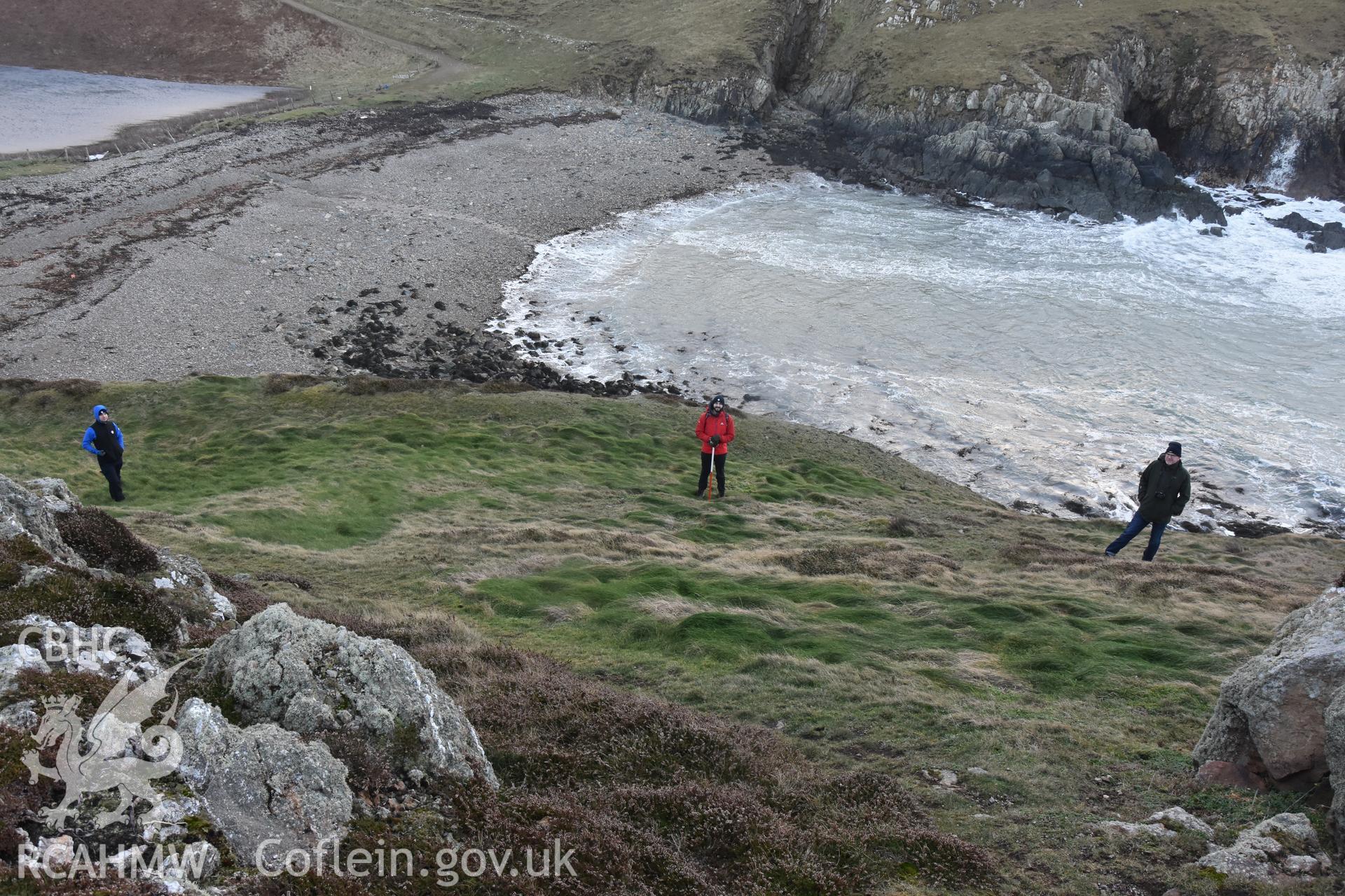 Ynys y Fydlyn Promontory Fort. 3 figures and 2m scale. Taken by Lou Barker. Produced with EU funds through the Ireland Wales Co-operation Programme 2014-2023. All material made freely available through the Open Government Licence.