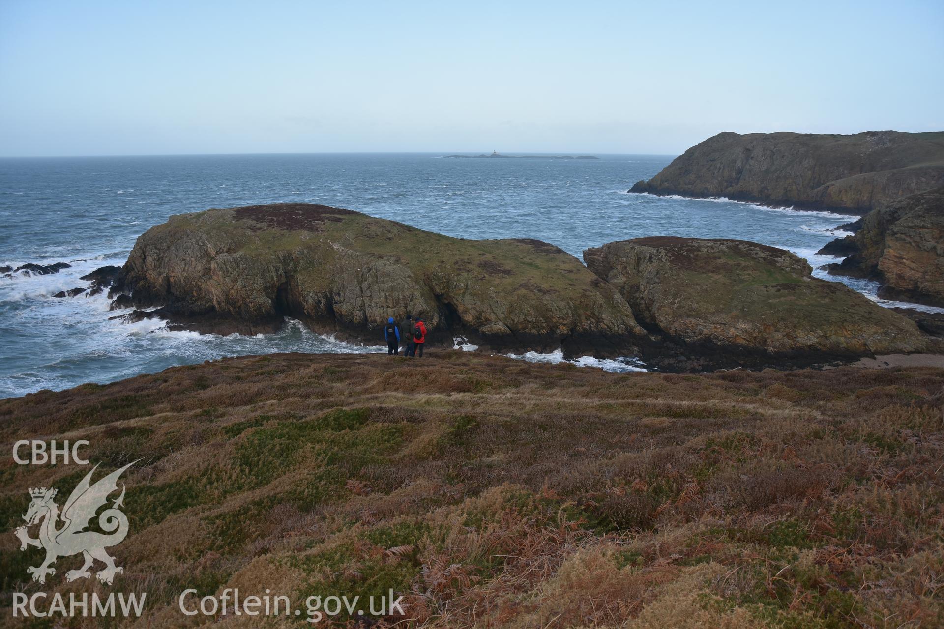 Ynys y Fydlyn Promontory Fort with figures for scale. Taken by Lou Barker. Produced with EU funds through the Ireland Wales Co-operation Programme 2014-2023. All material made freely available through the Open Government Licence.