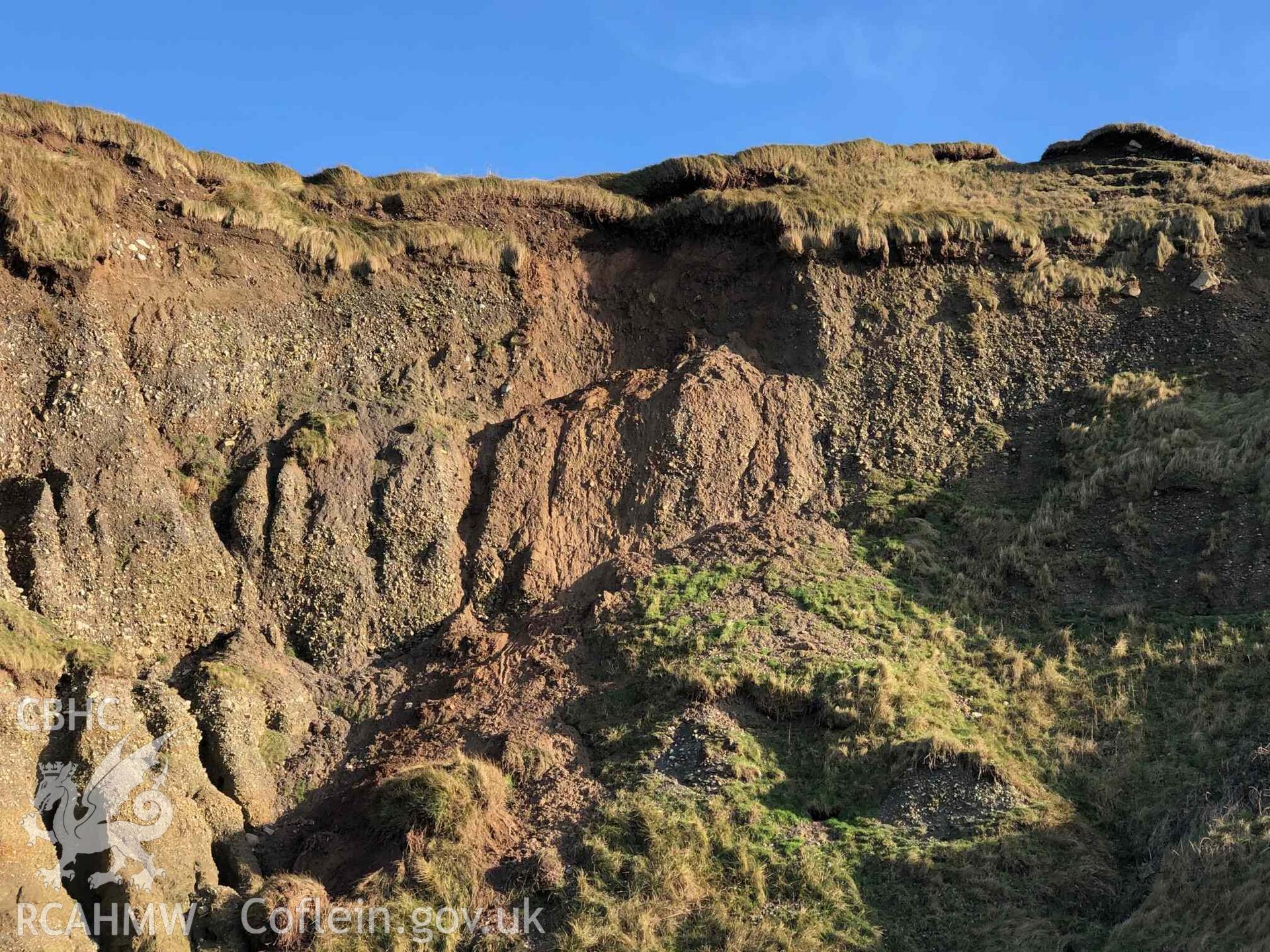 Close up of eroding edge with movement of sediments and turf. Taken by Toby Driver. Produced with EU funds through the Ireland Wales Co-operation Programme 2014-2023. All material made freely available through the Open Government Licence.