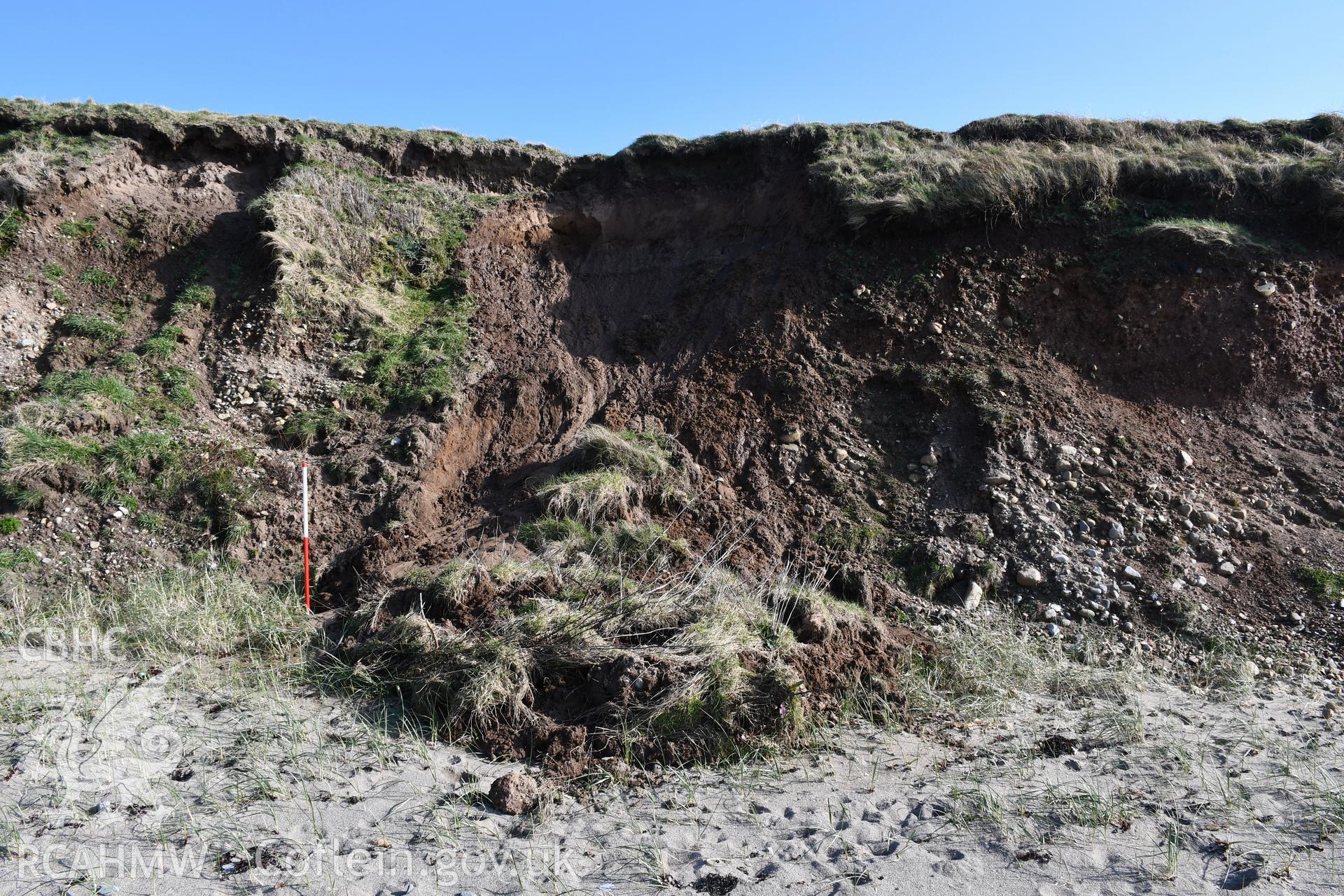 Close up of area where sediments have moved significantly, along with covering turf. 2m scale. Taken by Toby Driver. Produced with EU funds through the Ireland Wales Co-operation Programme 2014-2023. All material made freely available through the Open Gov