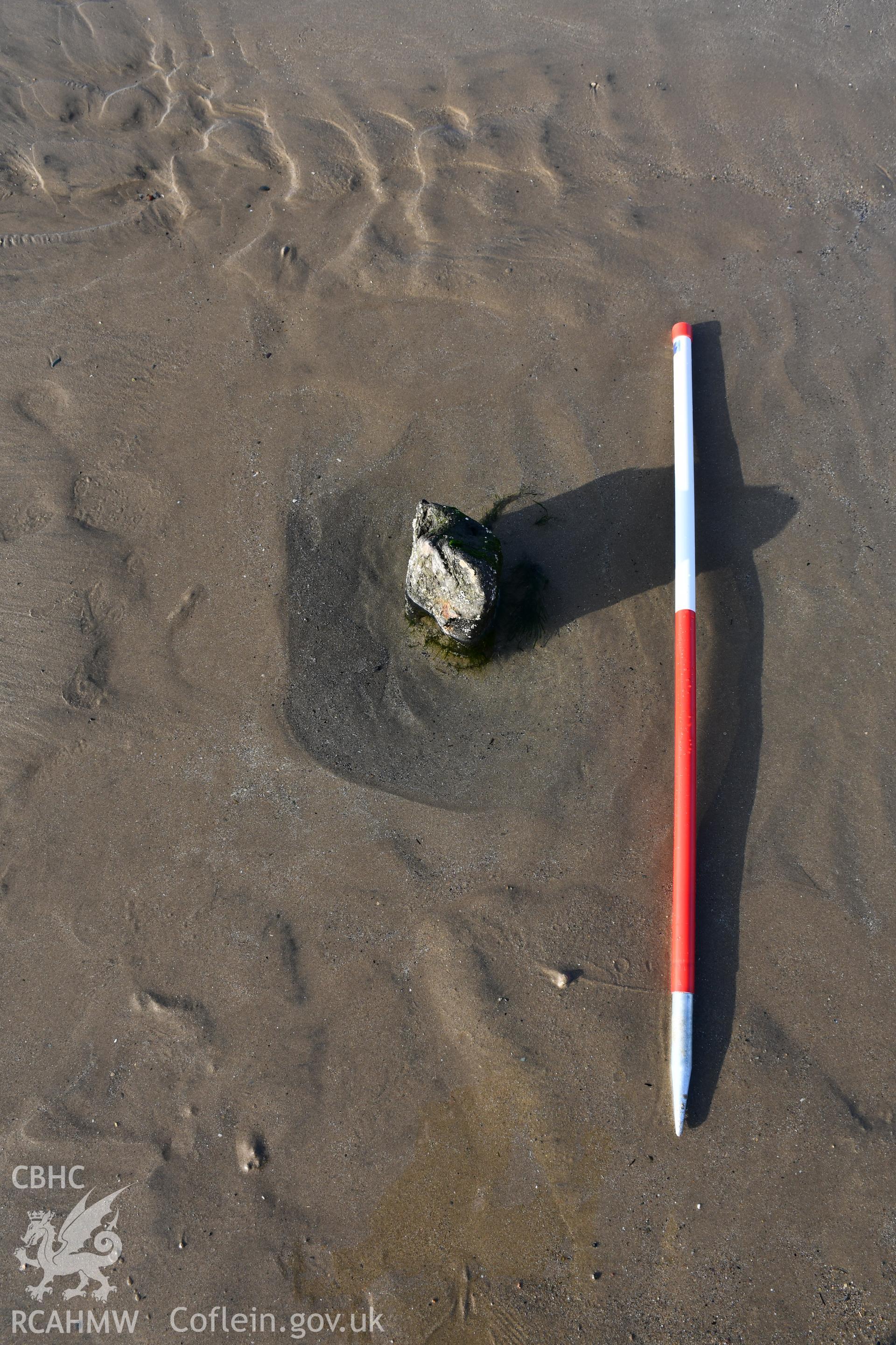 Part of a wreck near Morfa Dinlle, 2m scale. Photograph taken by Toby Driver in March 2021 as part of repeat monitoring and survey by the CHERISH project. © Crown: CHERISH PROJECT 2021. Produced with EU funds through the Ireland Wales Co-operation Programme 2014-2023. All material made freely available through the Open Government Licence.